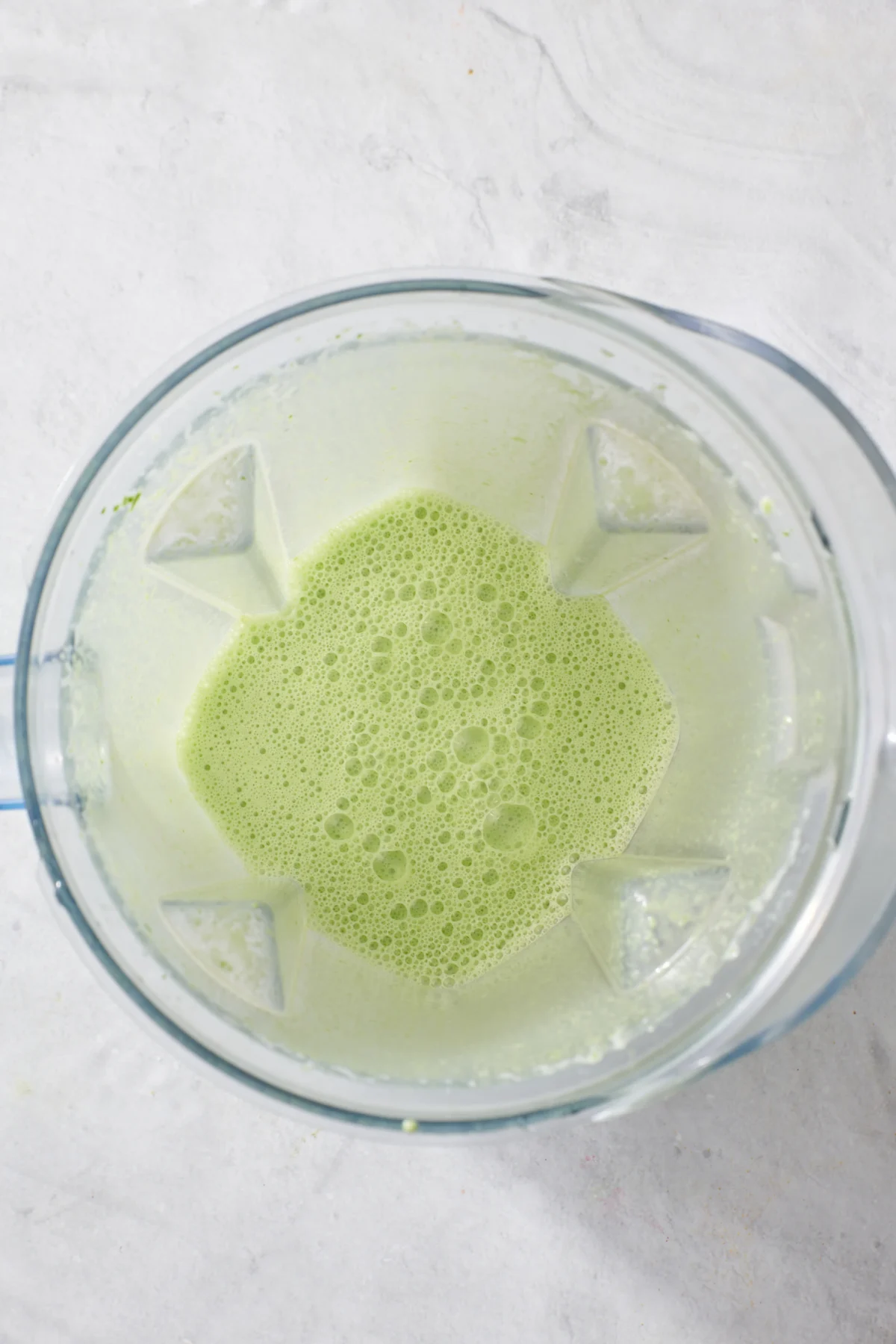 Blended wet ingredients for green pancakes.