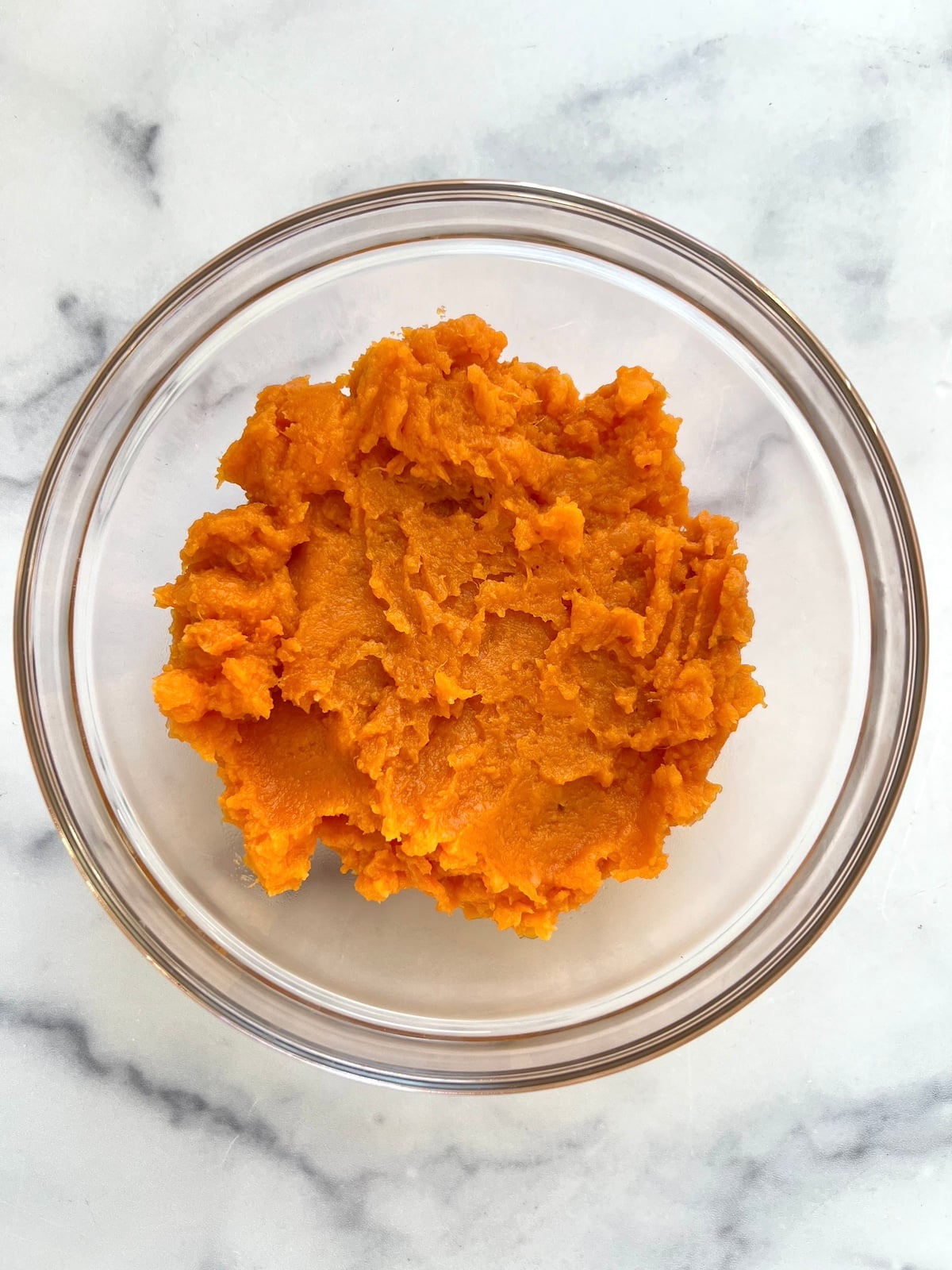 Mashed sweet potato in a bowl.