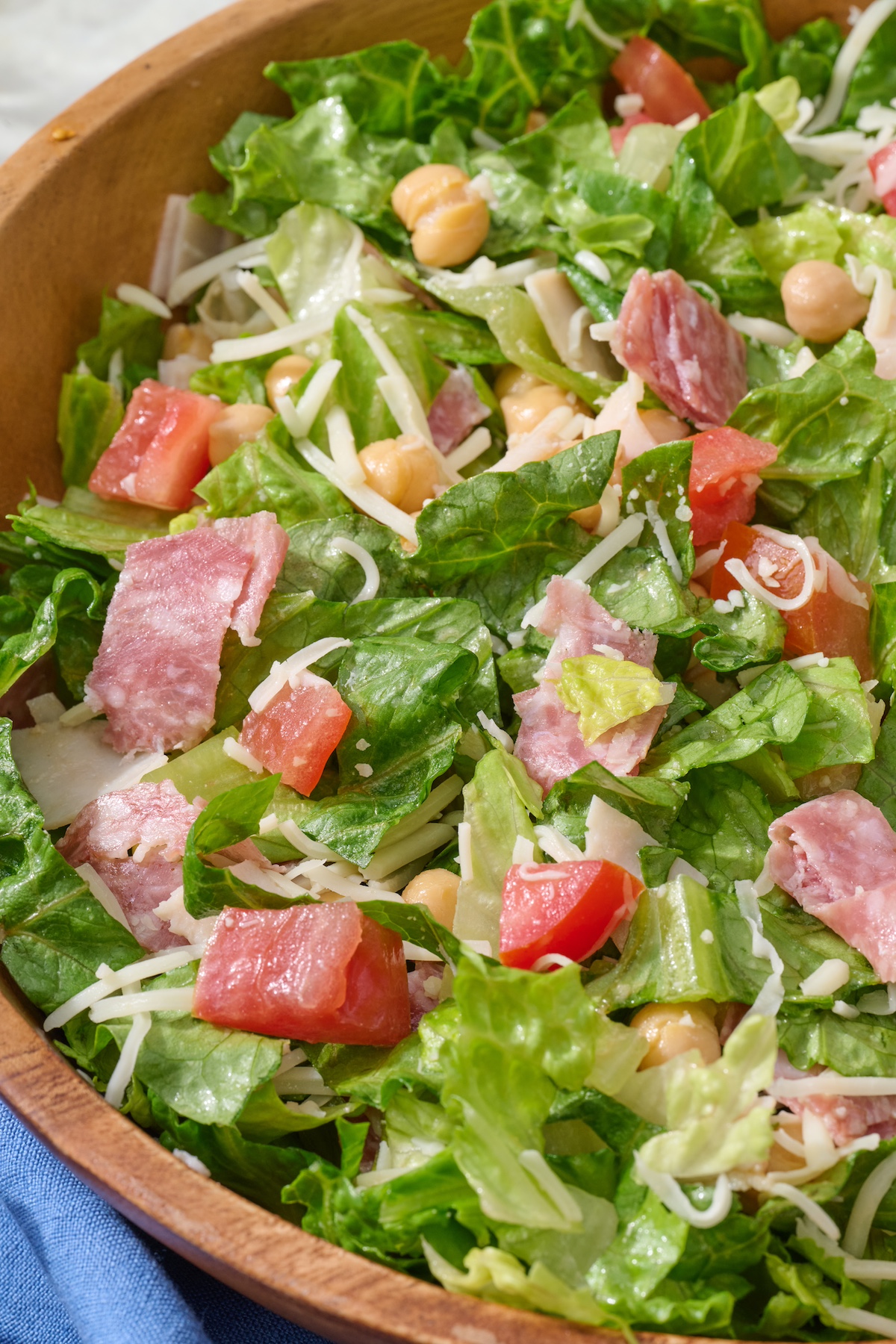 Italian chopped salad in wooden serving bowl.