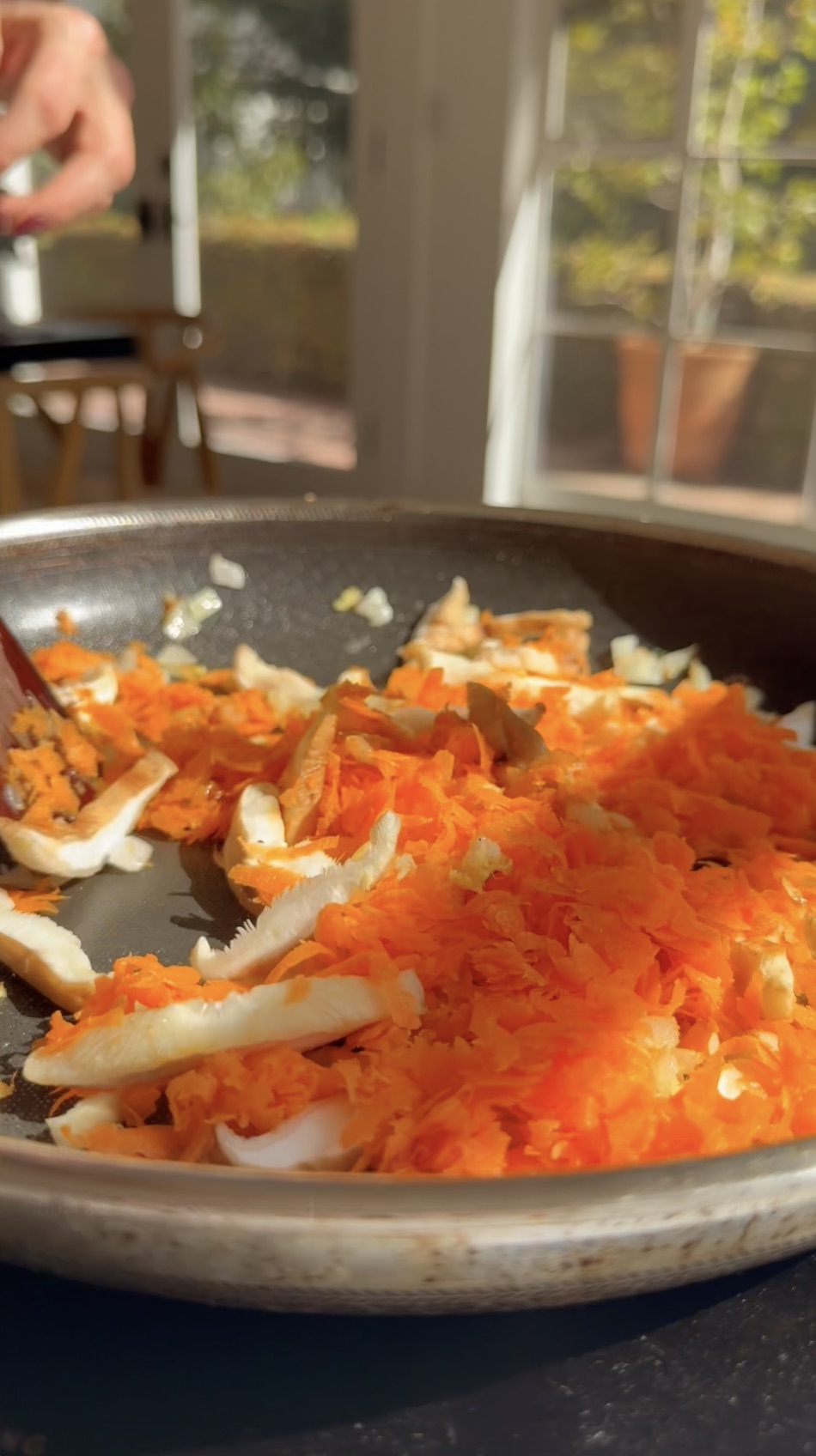 Sauteed vegetables in a pan.