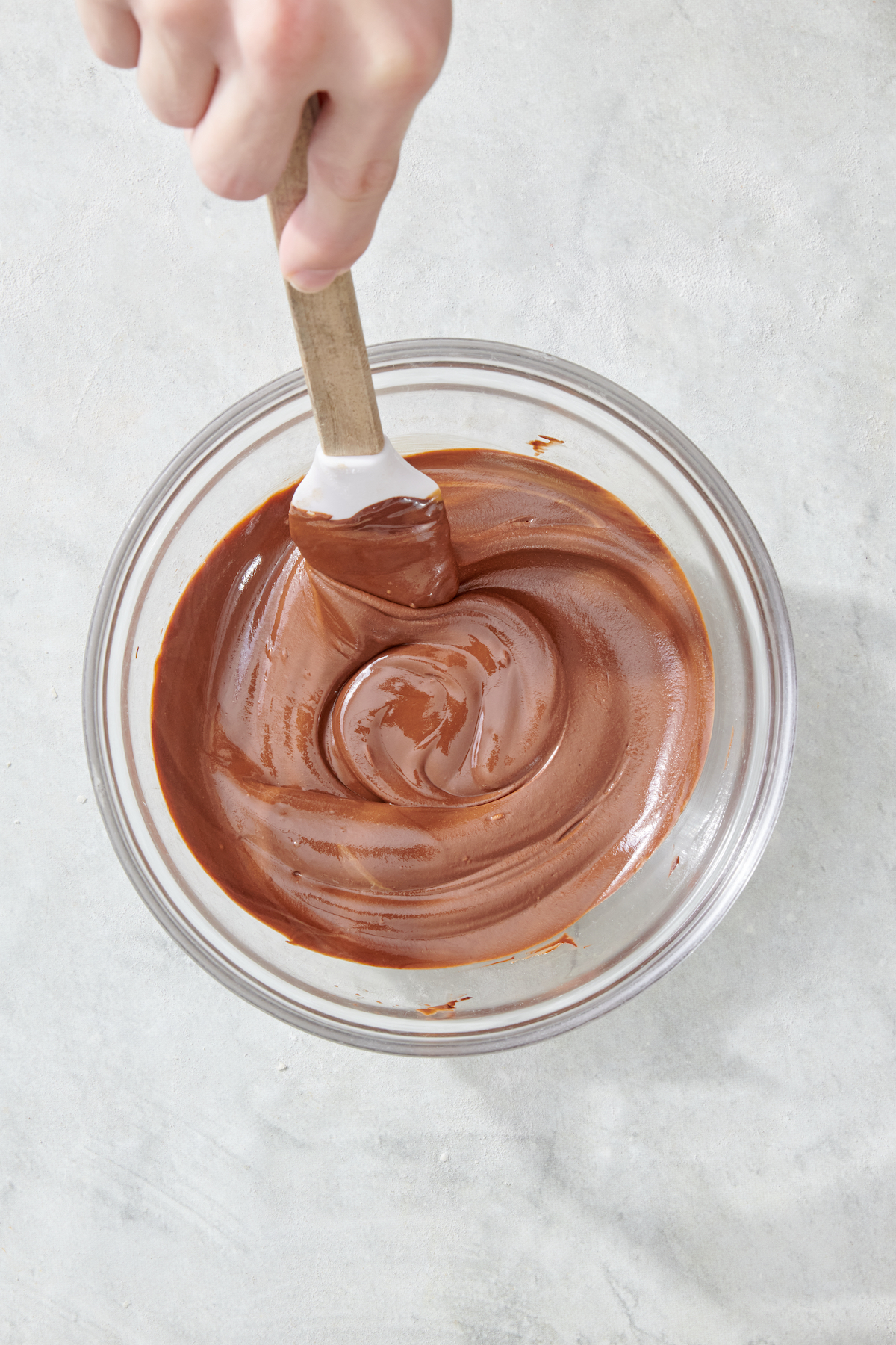 Stirring chocolate sunbutter spread.