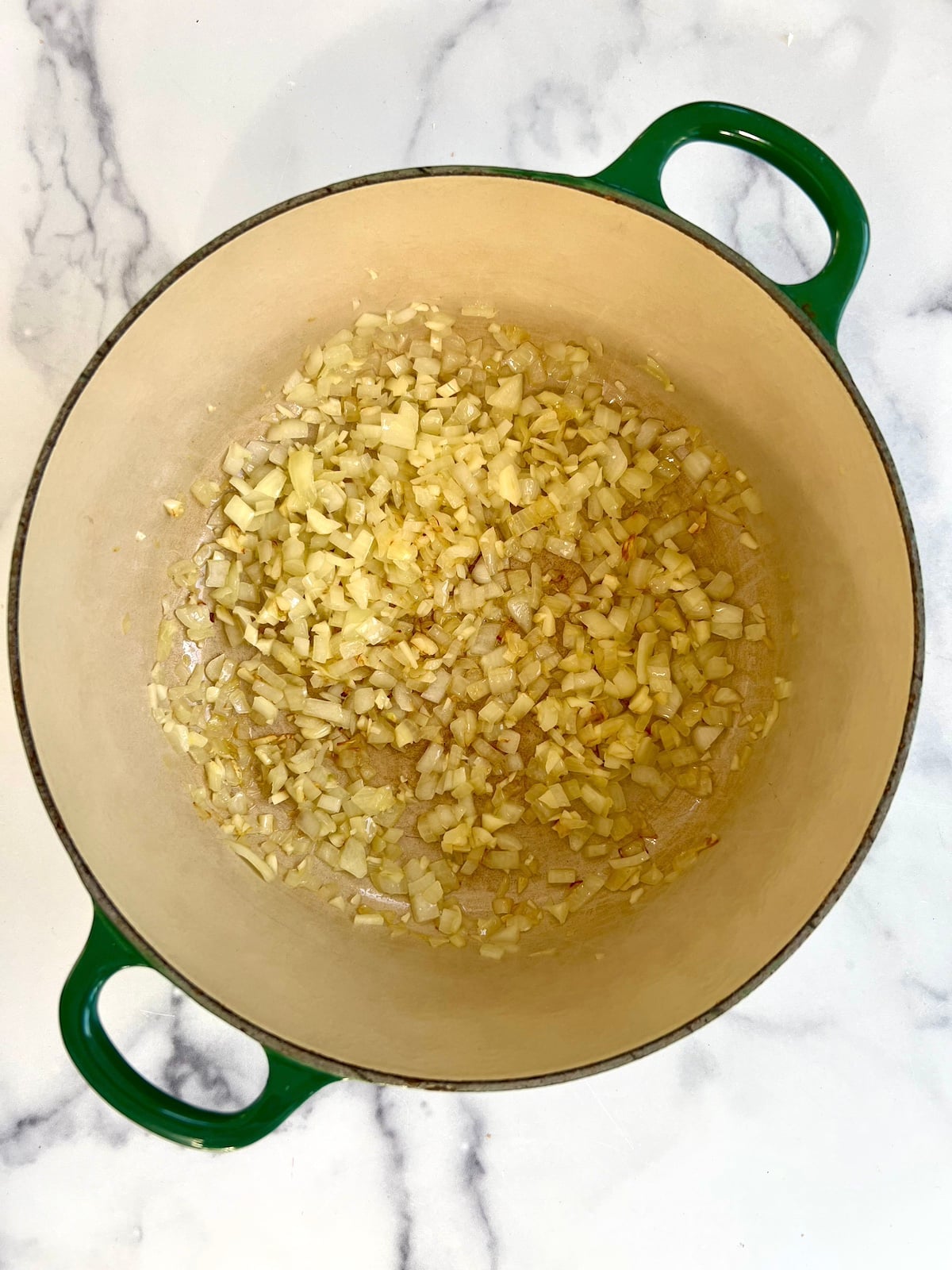 Onions and garlic sautéing in stock pot.