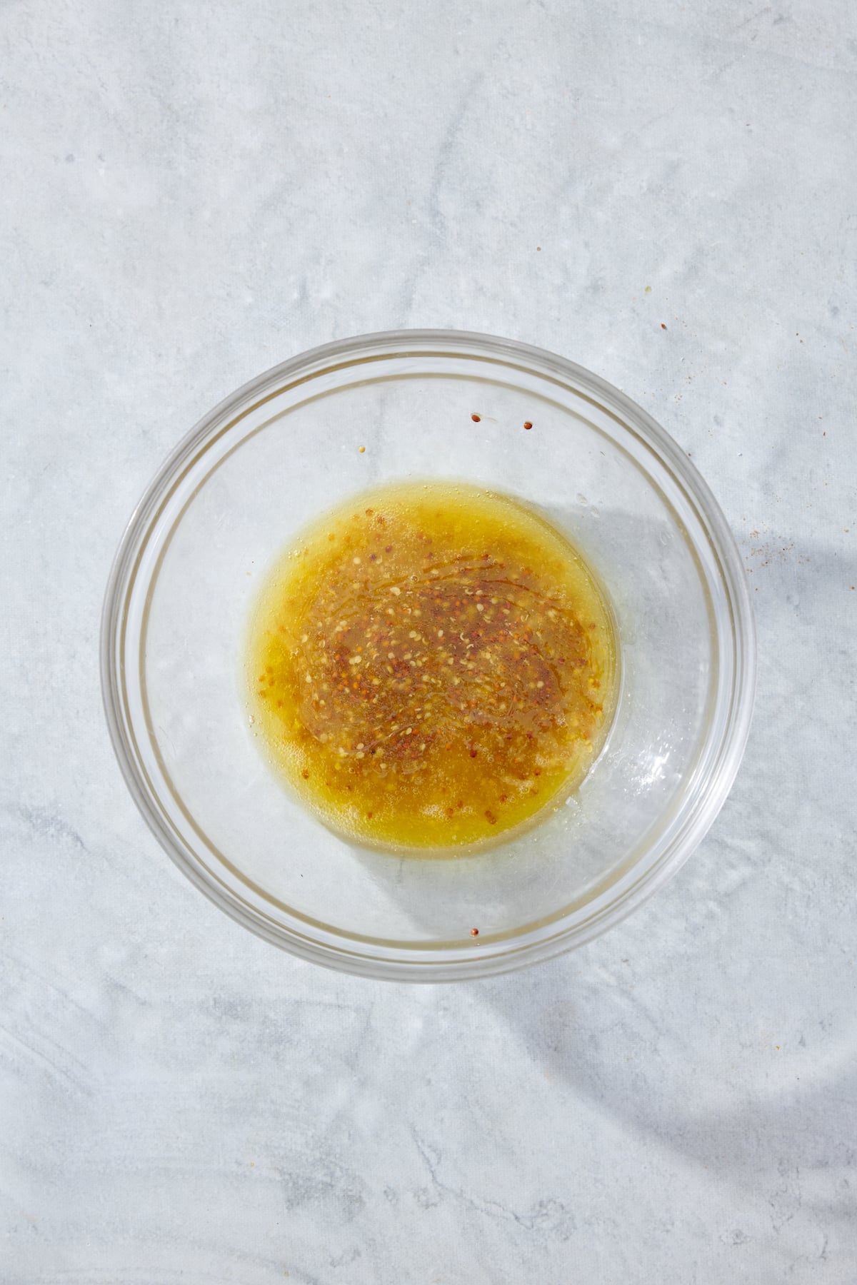 Mustard vinaigrette in a clear bowl
