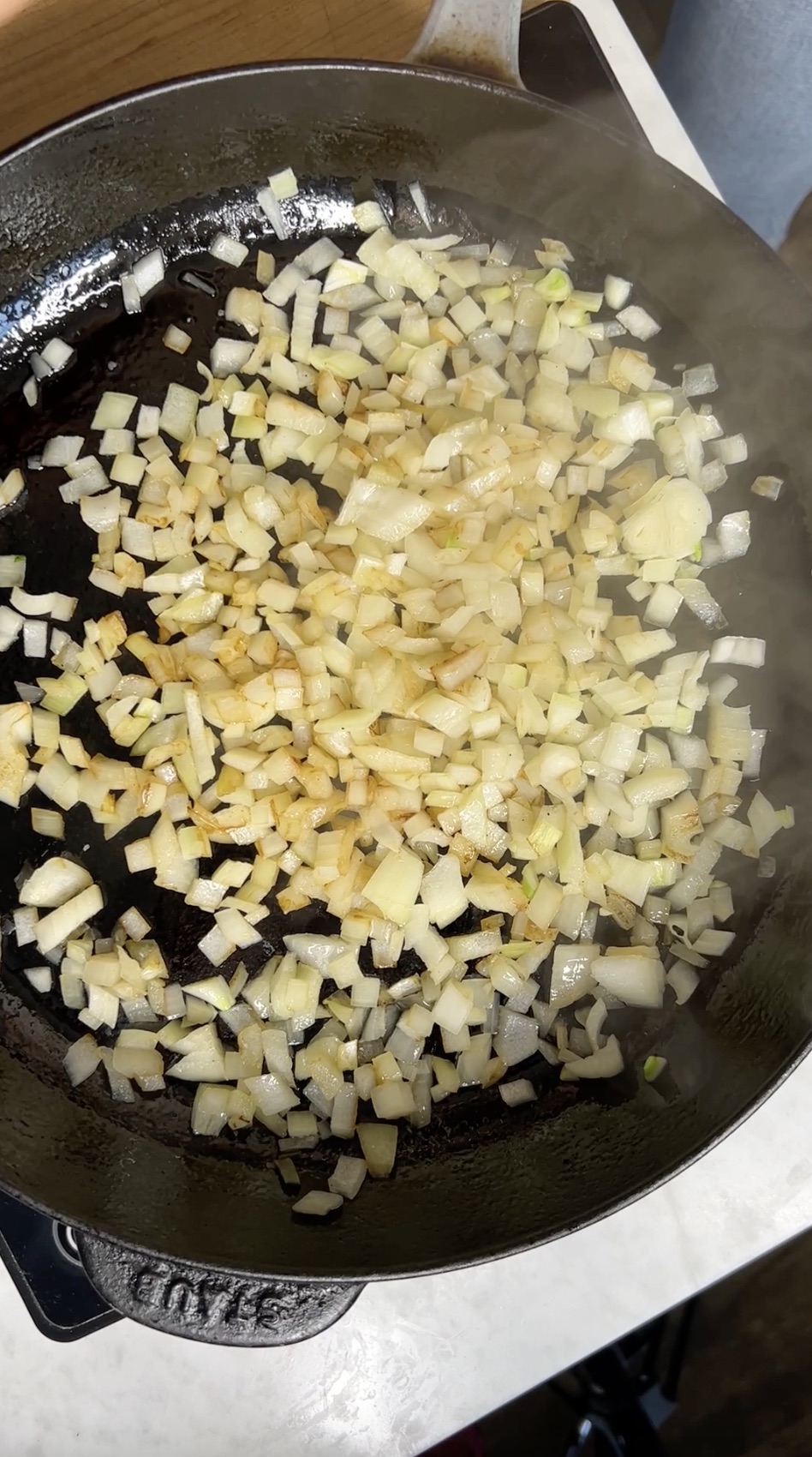 Sauteed onions in a skillet.