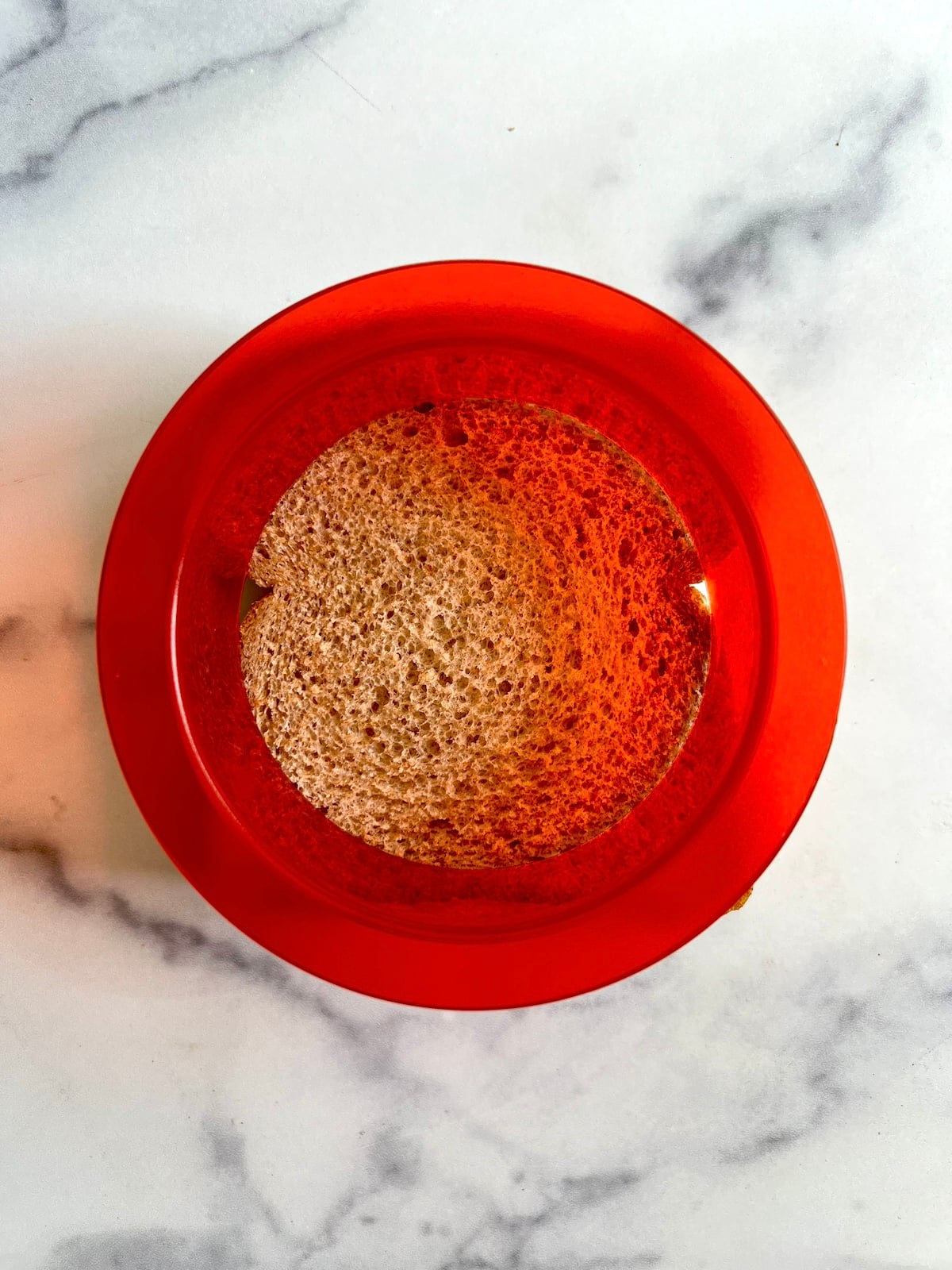 Uncrustables sandwich cutter on top of assembled sandwich.