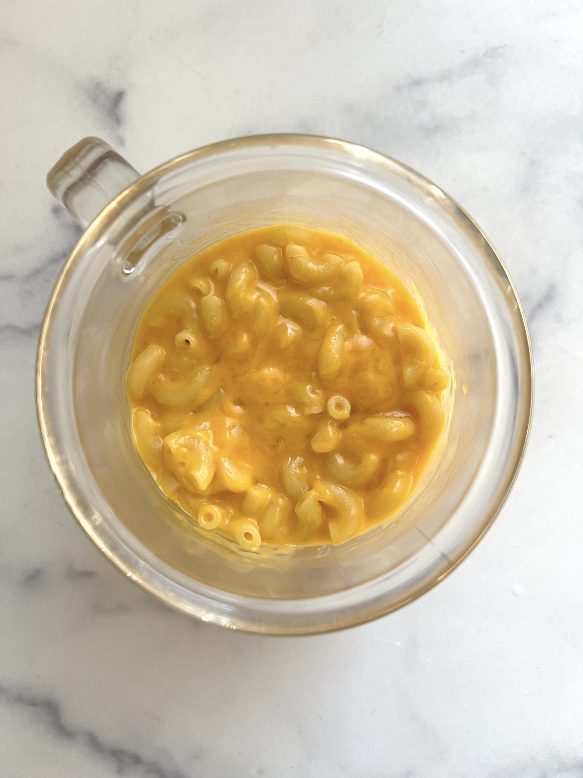 Pumpkin puree, milk and salt mixed in with pasta.