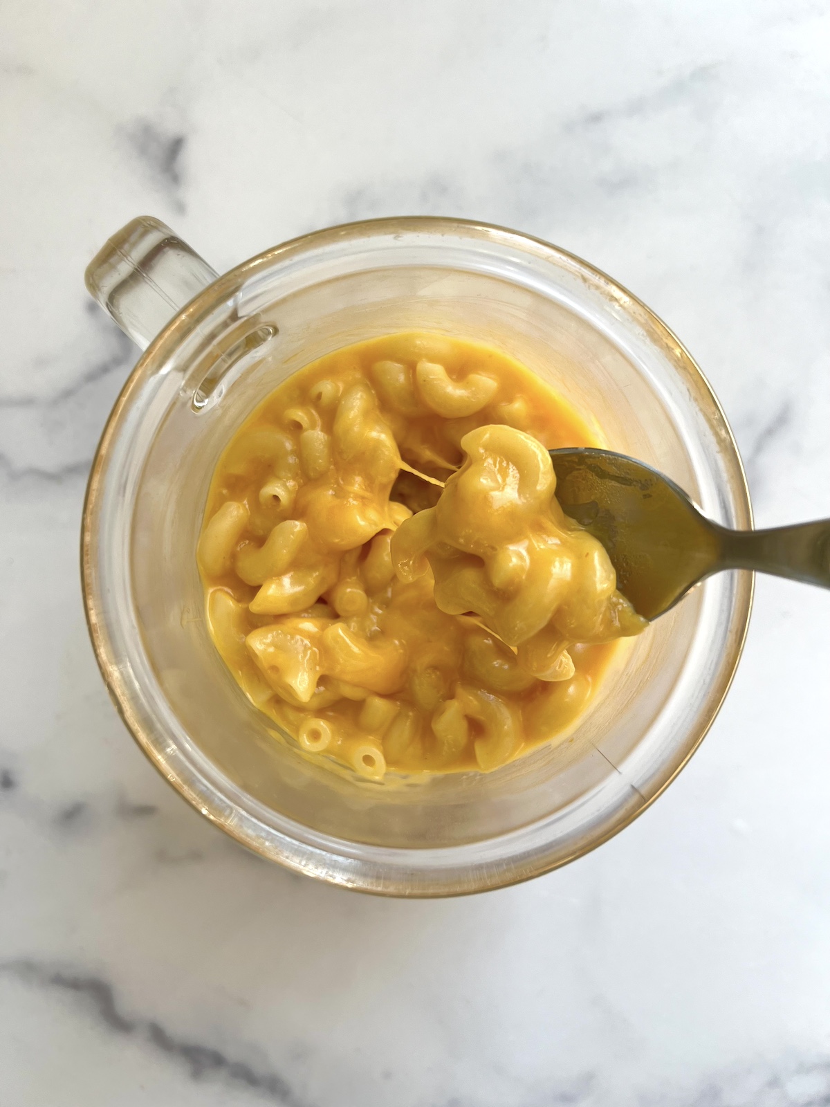 Pumpkin mac and cheese in a mug.