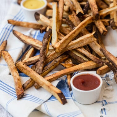 Air fryer french fries on tea towel.