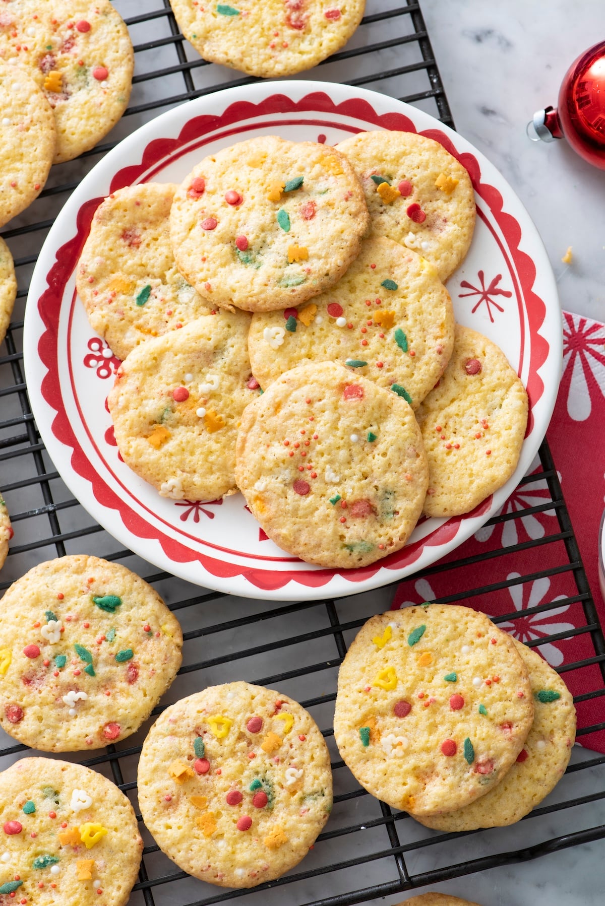 Cake Mix Sprinkle Cookies on red and white plate.