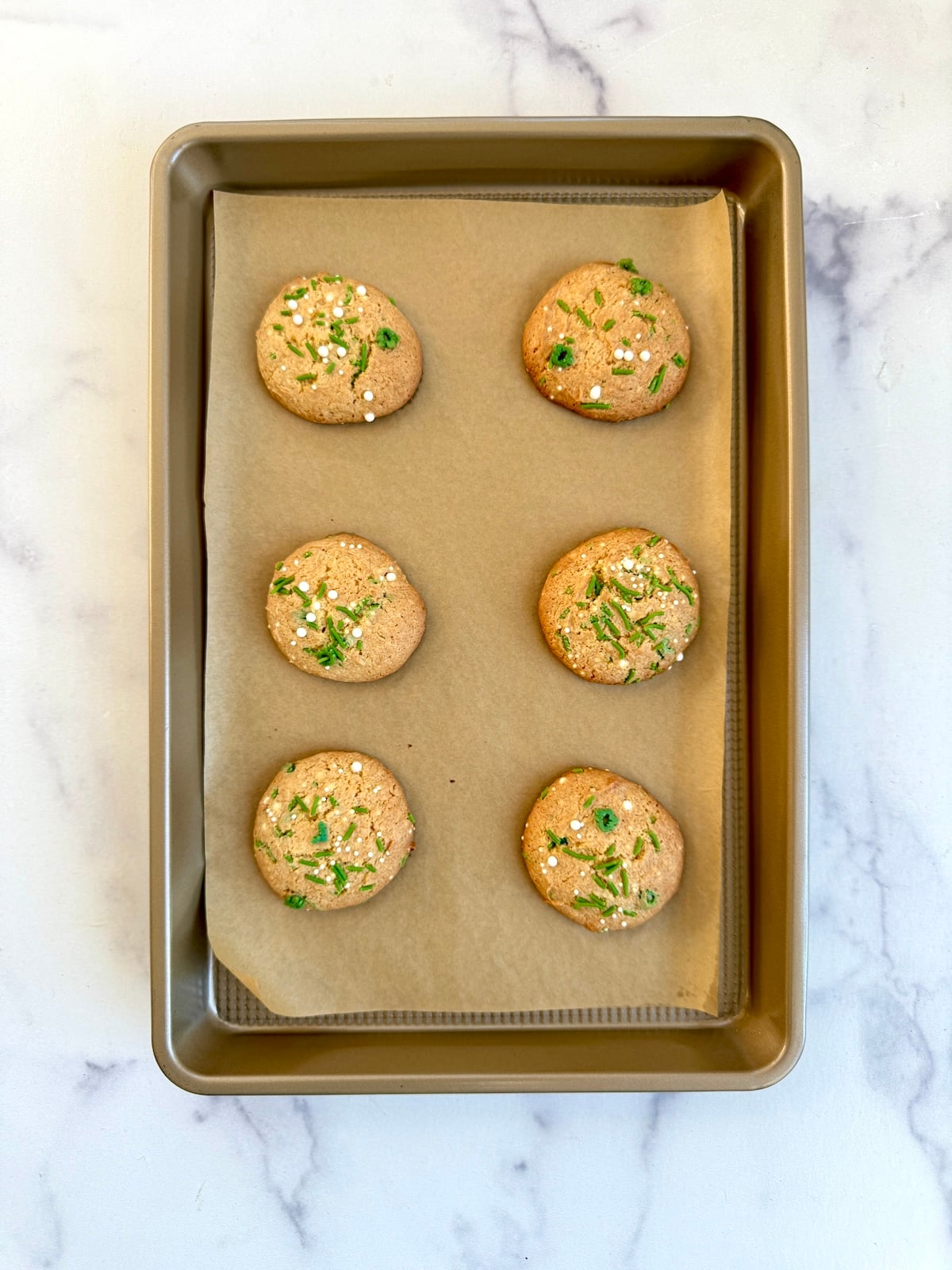 Cake mix sprinkle cookies on a baking sheet.