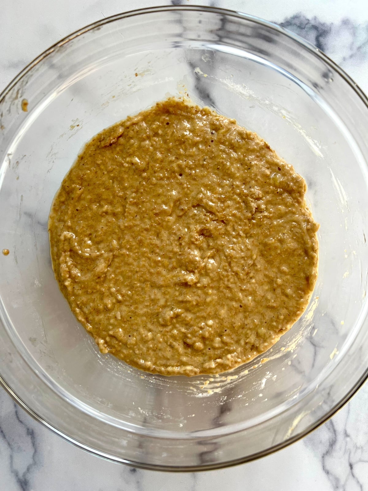 Banana wheat germ muffin batter in mixing bowl.