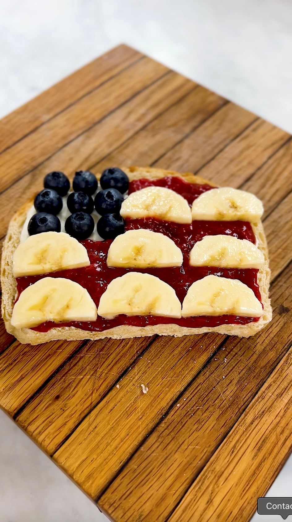 American flag toast on a wooden cutting board.