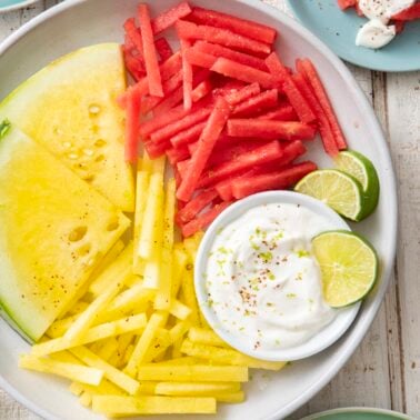 Yellow and red watermelon fries served with yogurt dip.