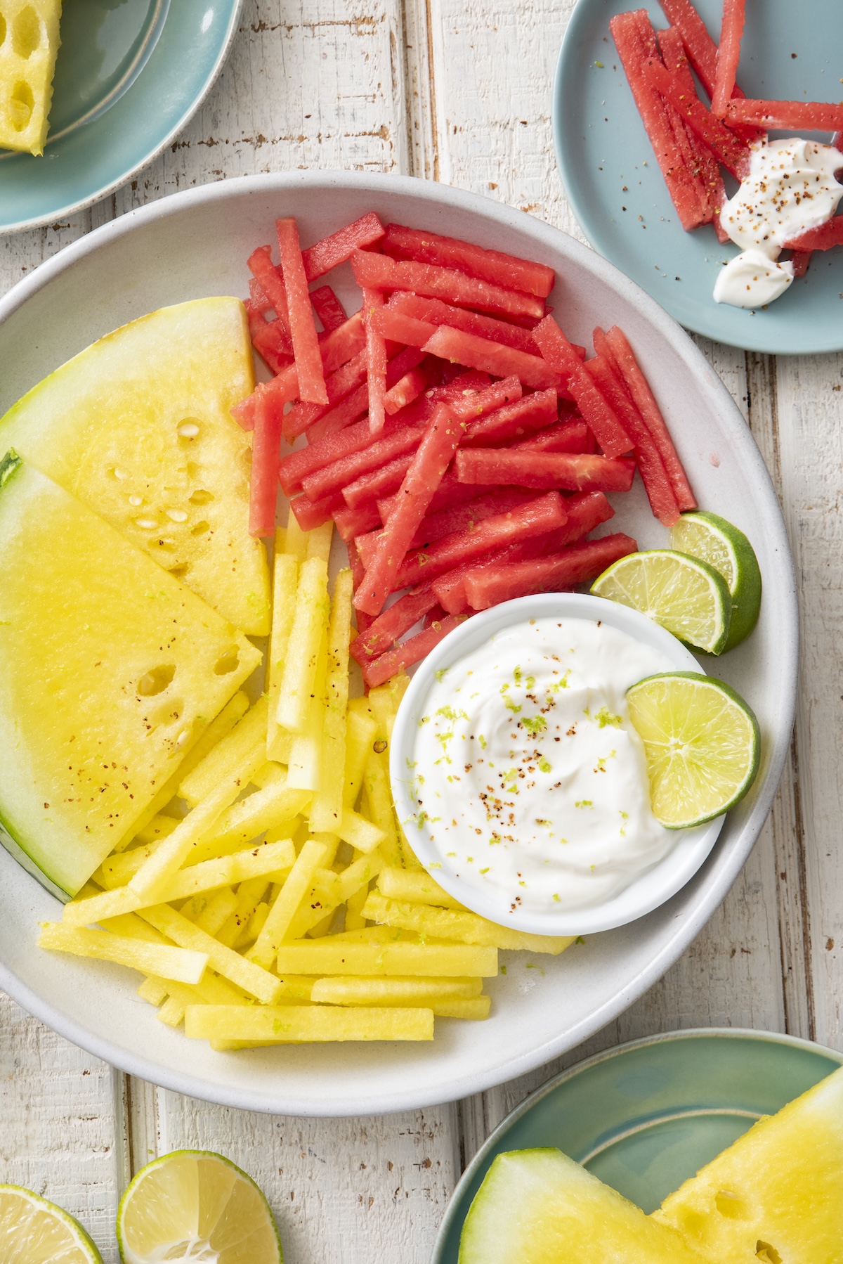 Yellow and red watermelon fries served with yogurt dip.