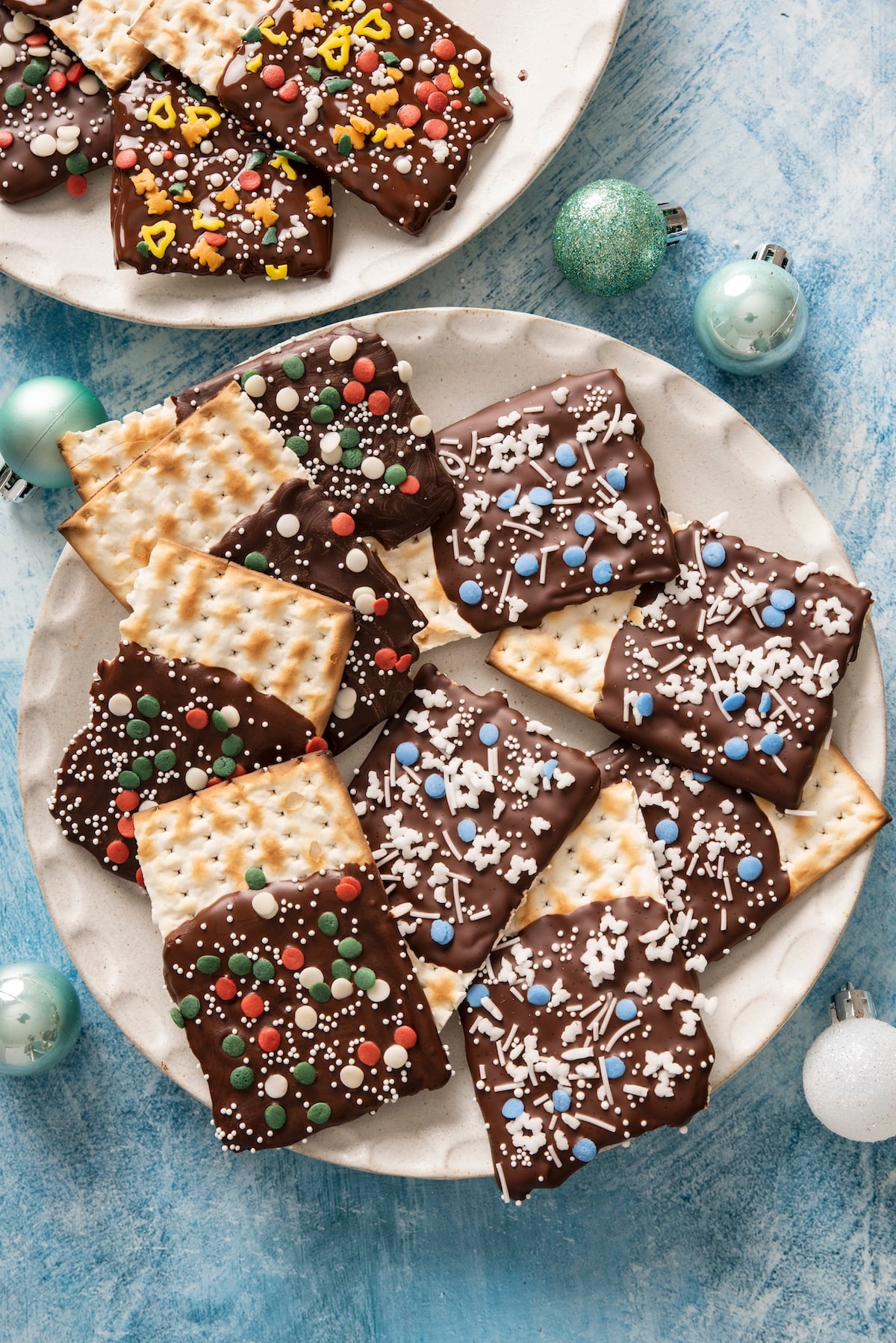 Matzah crackers dipped in chocolate and topped with sprinkles.