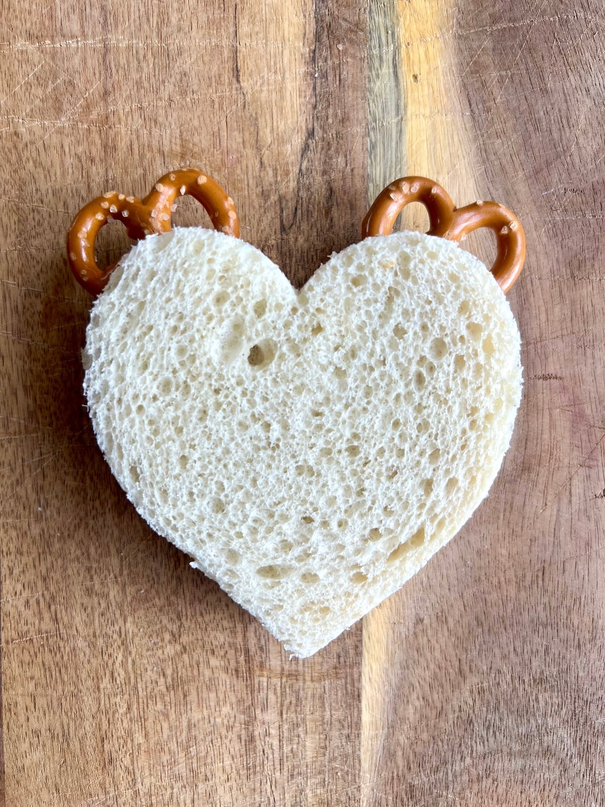 Pretzels in between heart shaped bread to look like antlers.