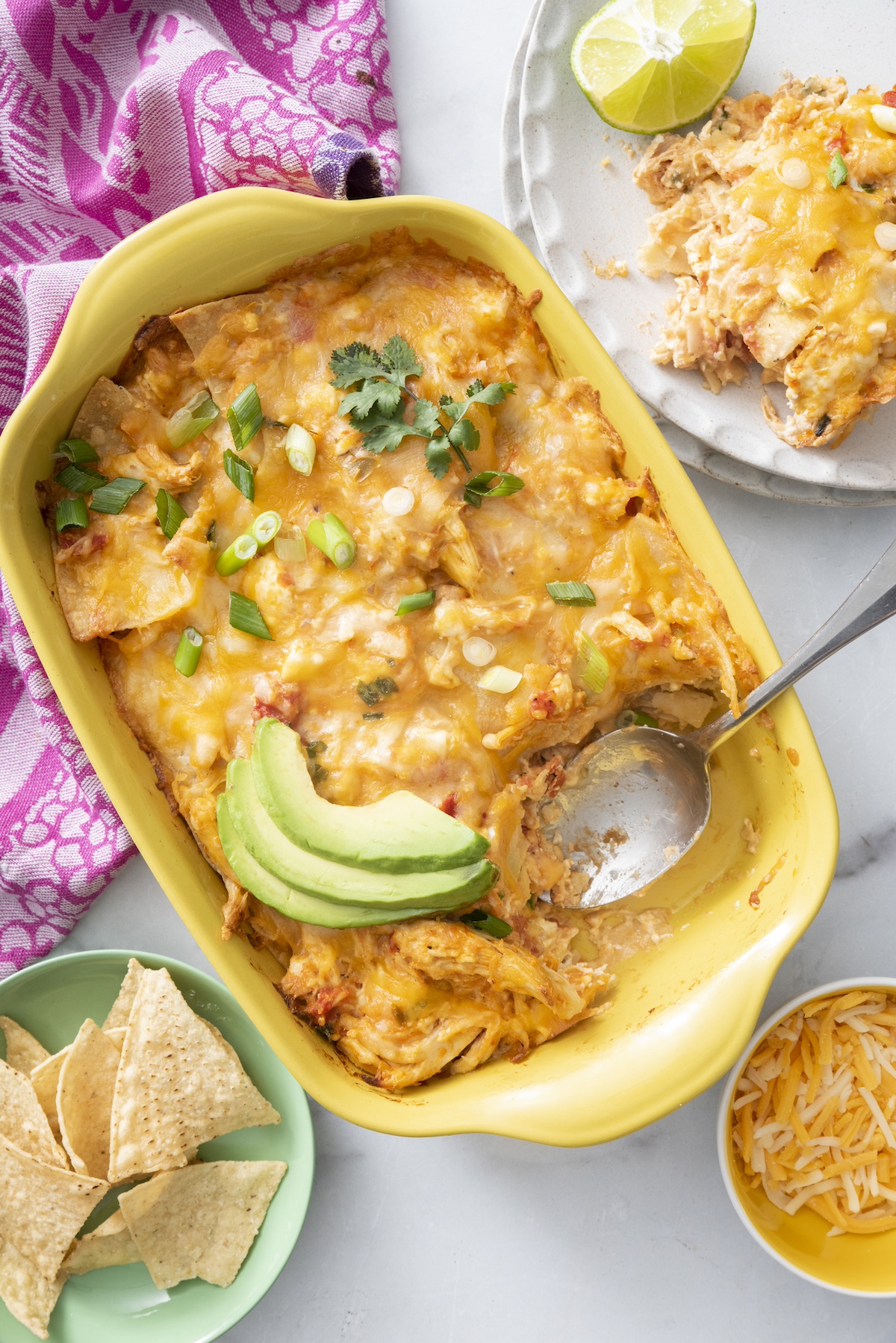 Mexican Lasagna topped with sliced avocado.