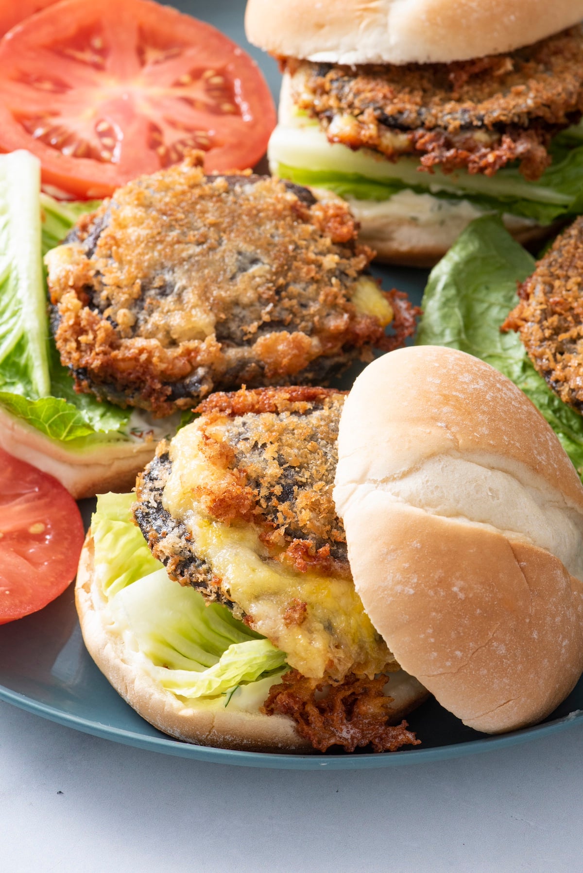 Shroom burgers on a plate.