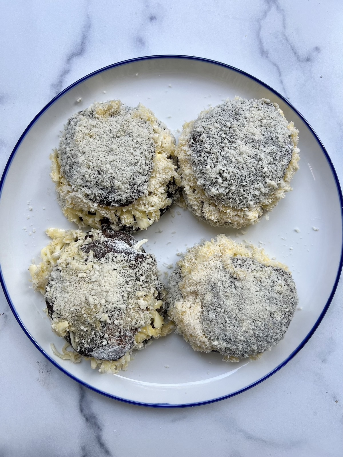 Breaded, cheese stuffed portobello mushrooms.