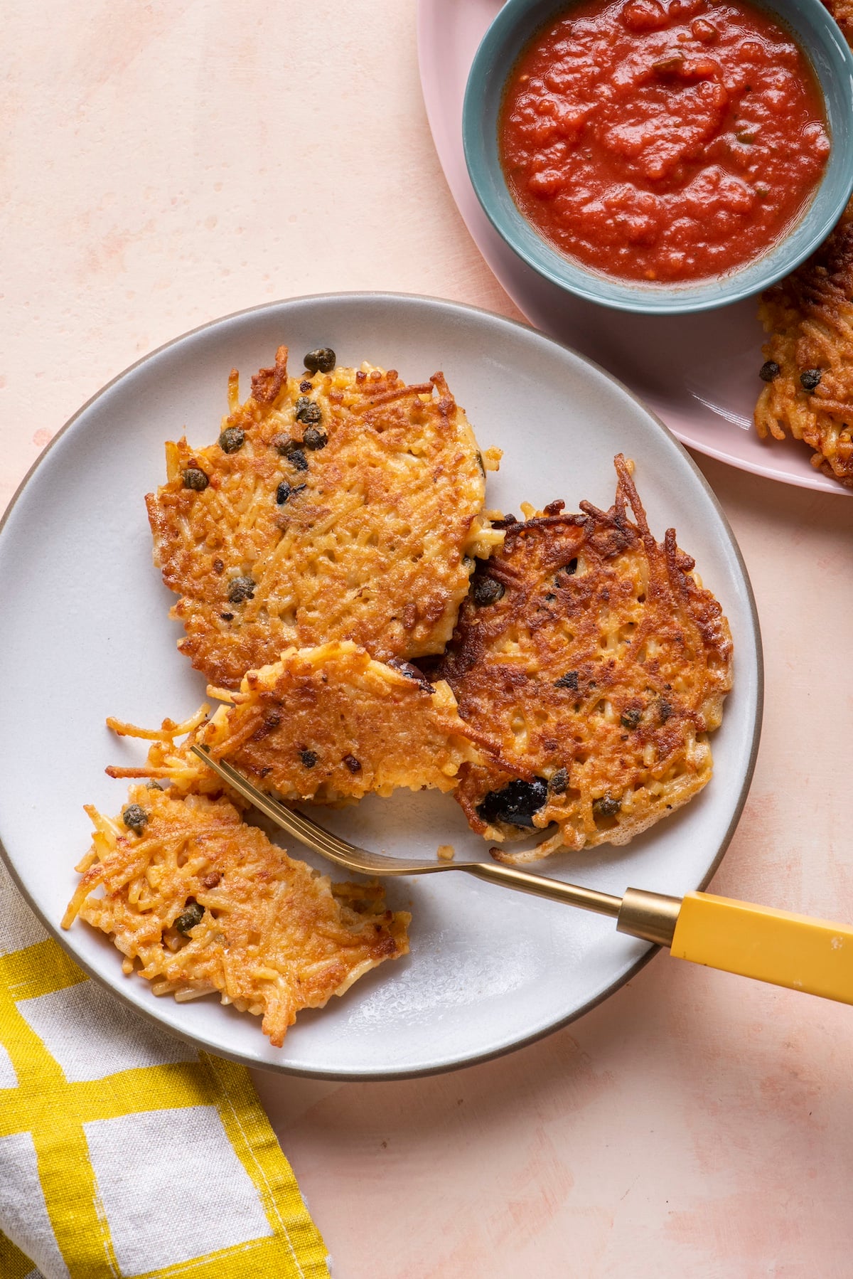 Fork cutting into spaghetti cake.
