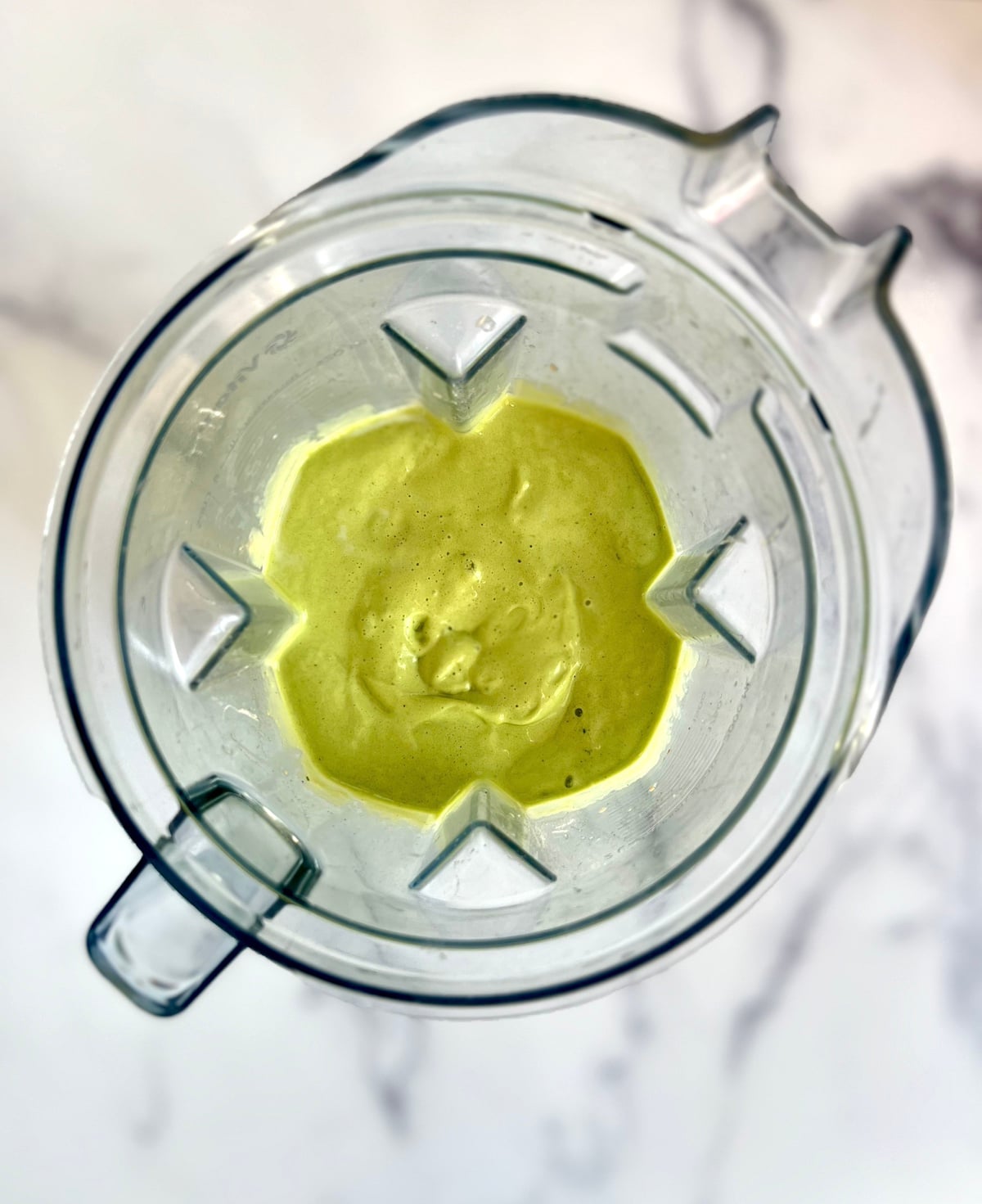 Green smoothie in a blender.