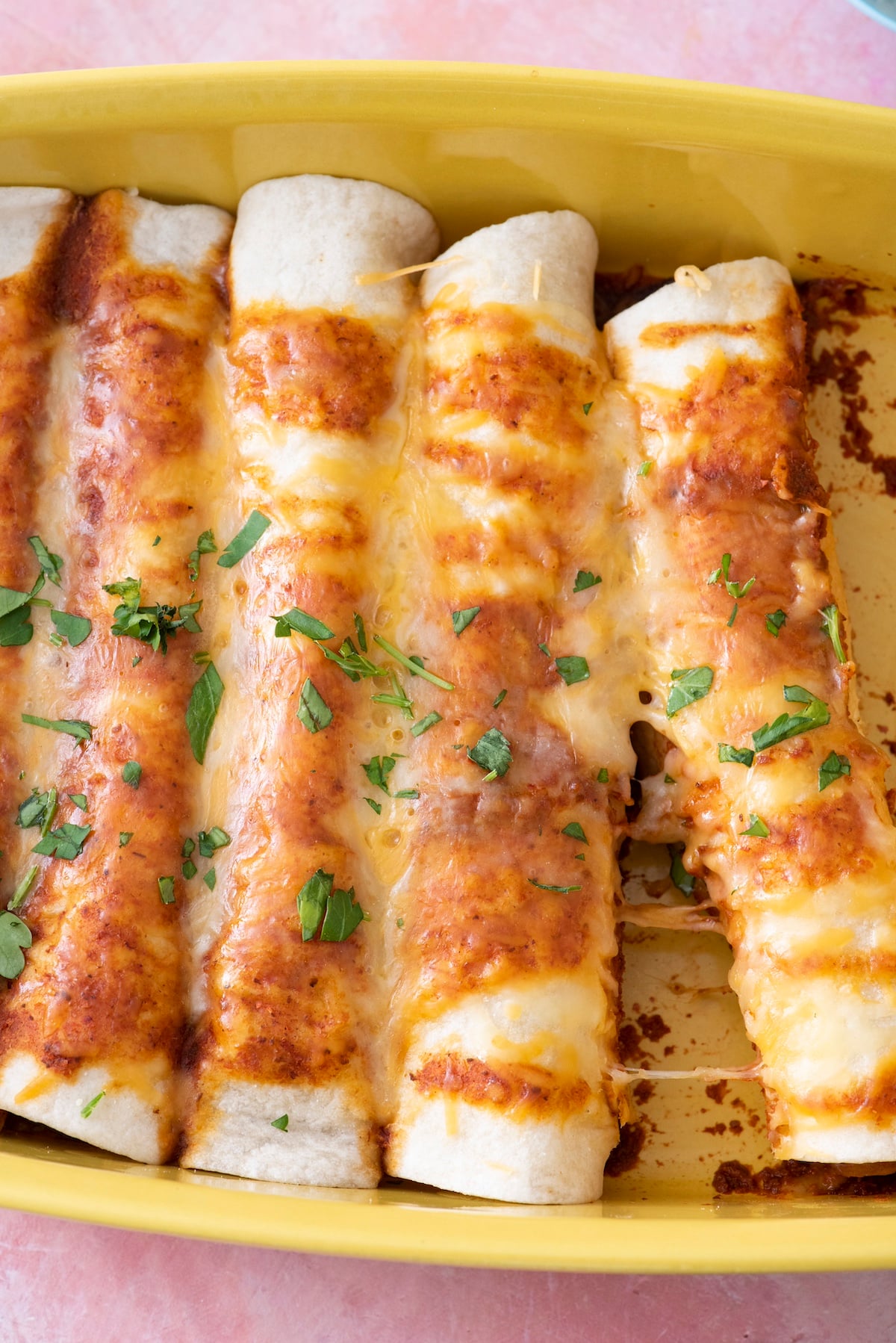 Mexican enchiladas in a baking dish.