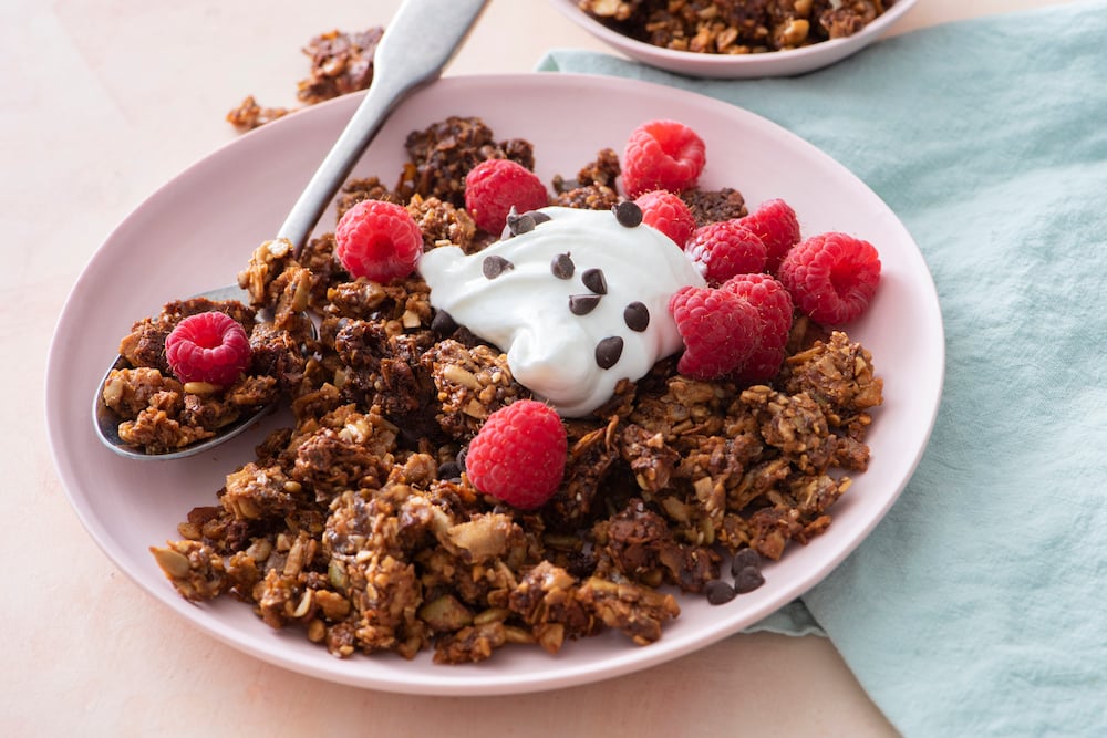 Granola with Greek yogurt and raspberries.
