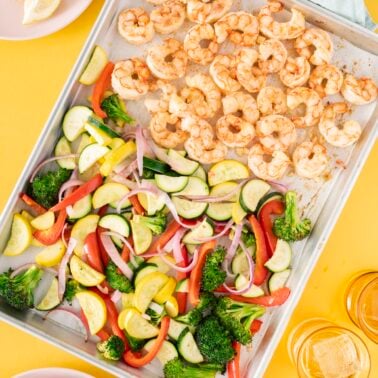 Sheet pan with shrimp and roasted vegetables.
