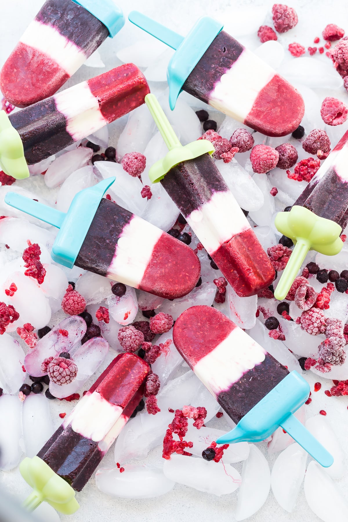 Red, white and blue popsicles on a bed of ice.