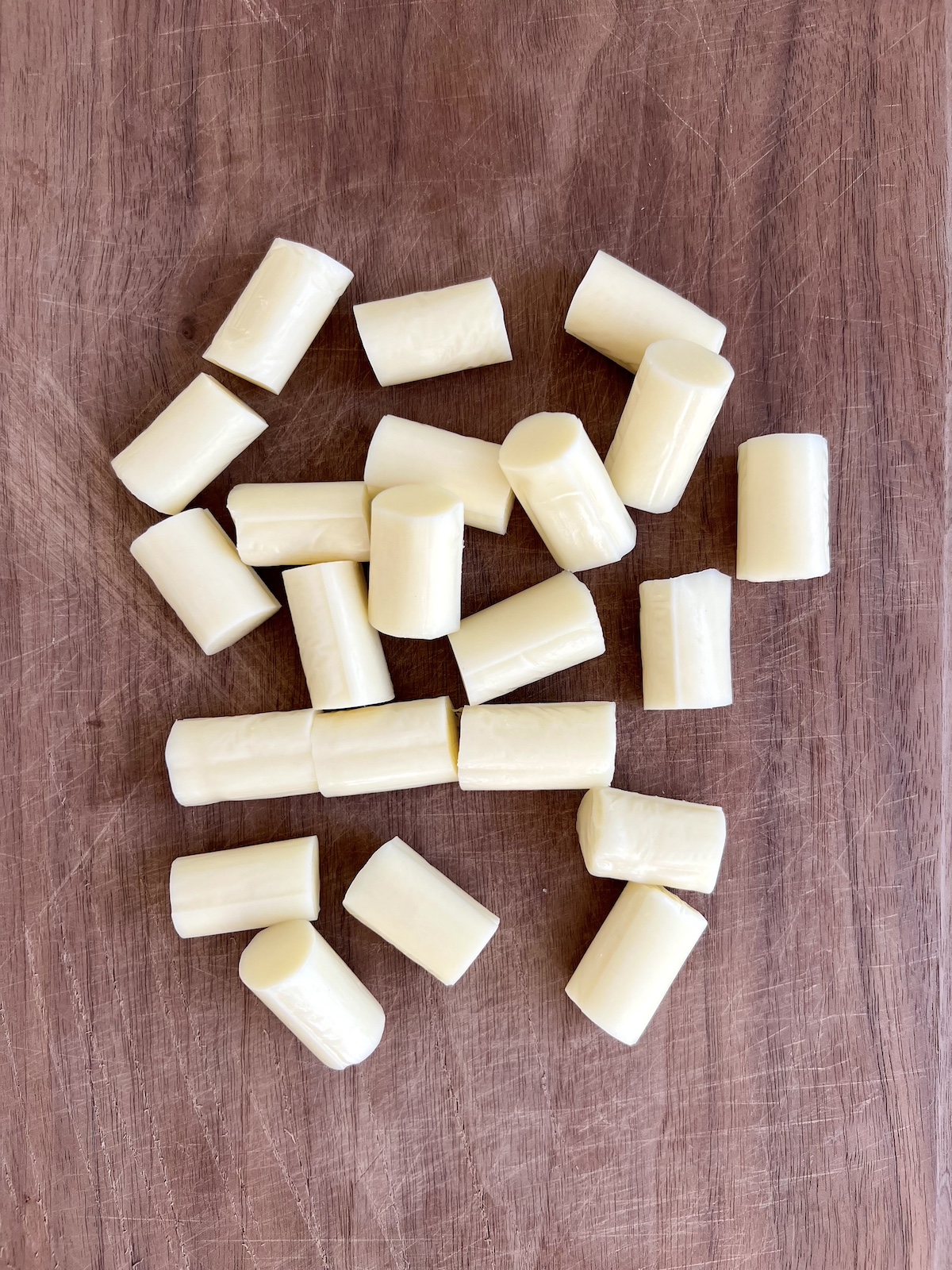 Cheese sticks cut into bite sized pieces.