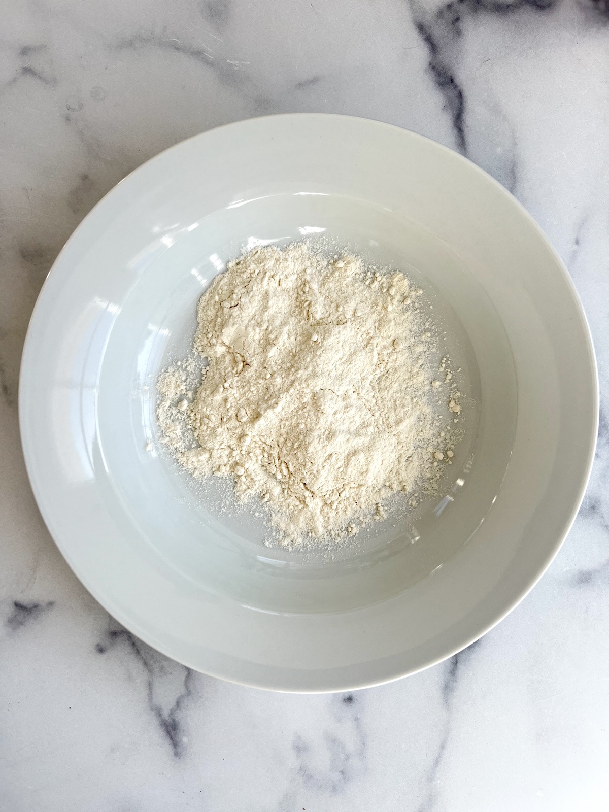Flour in a bowl.