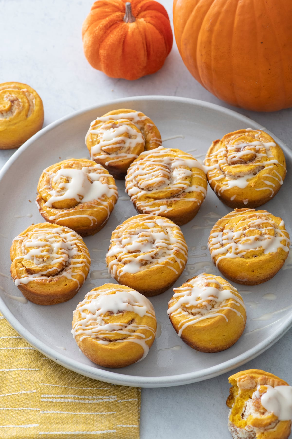 Quick pumpkin cinnamon rolls on a plate.