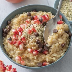 Leftover Rice Pudding topped with chocolate chips and pomegranate seeds.