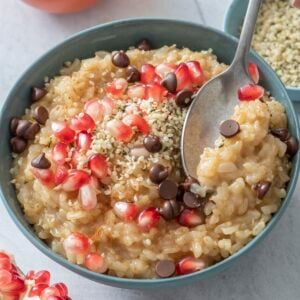 Leftover Rice Pudding topped with chocolate chips and pomegranate seeds.
