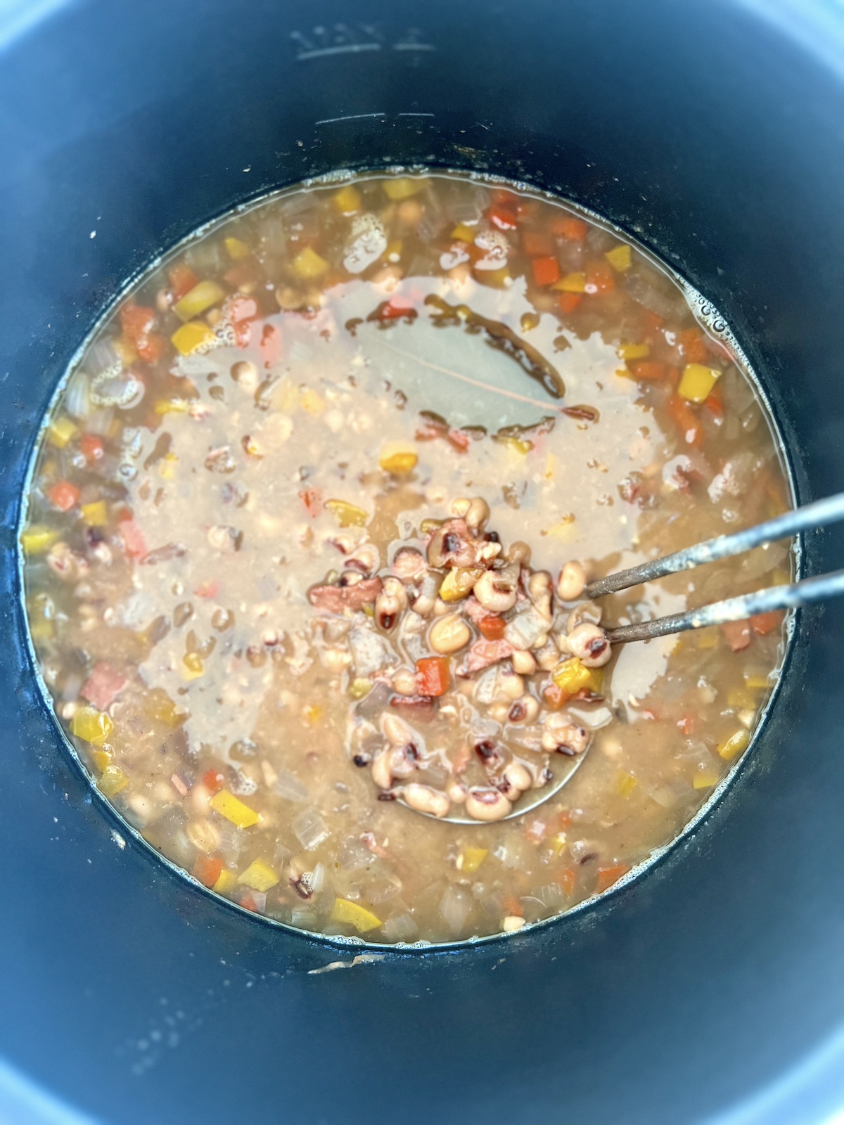 Slow cooked black eyed peas in a pot.