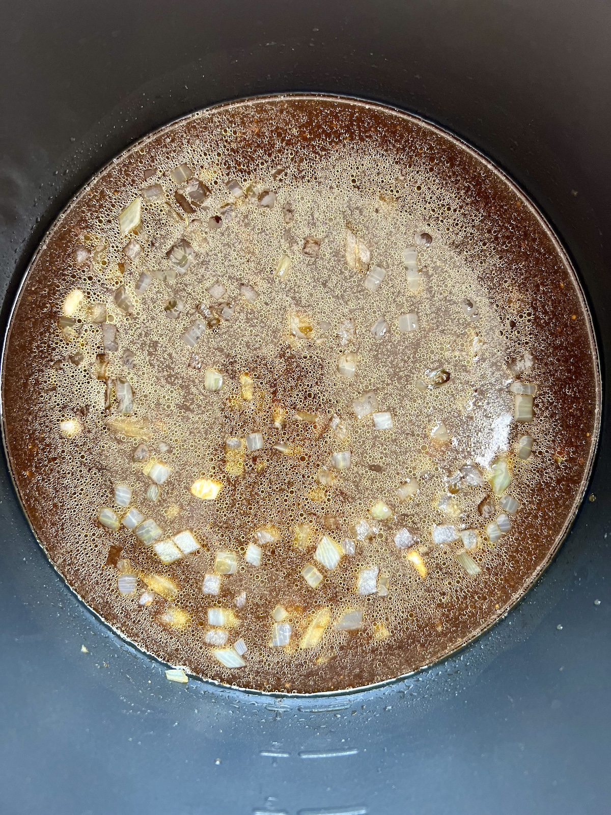 Baked beans ingredients in a slow cooker.