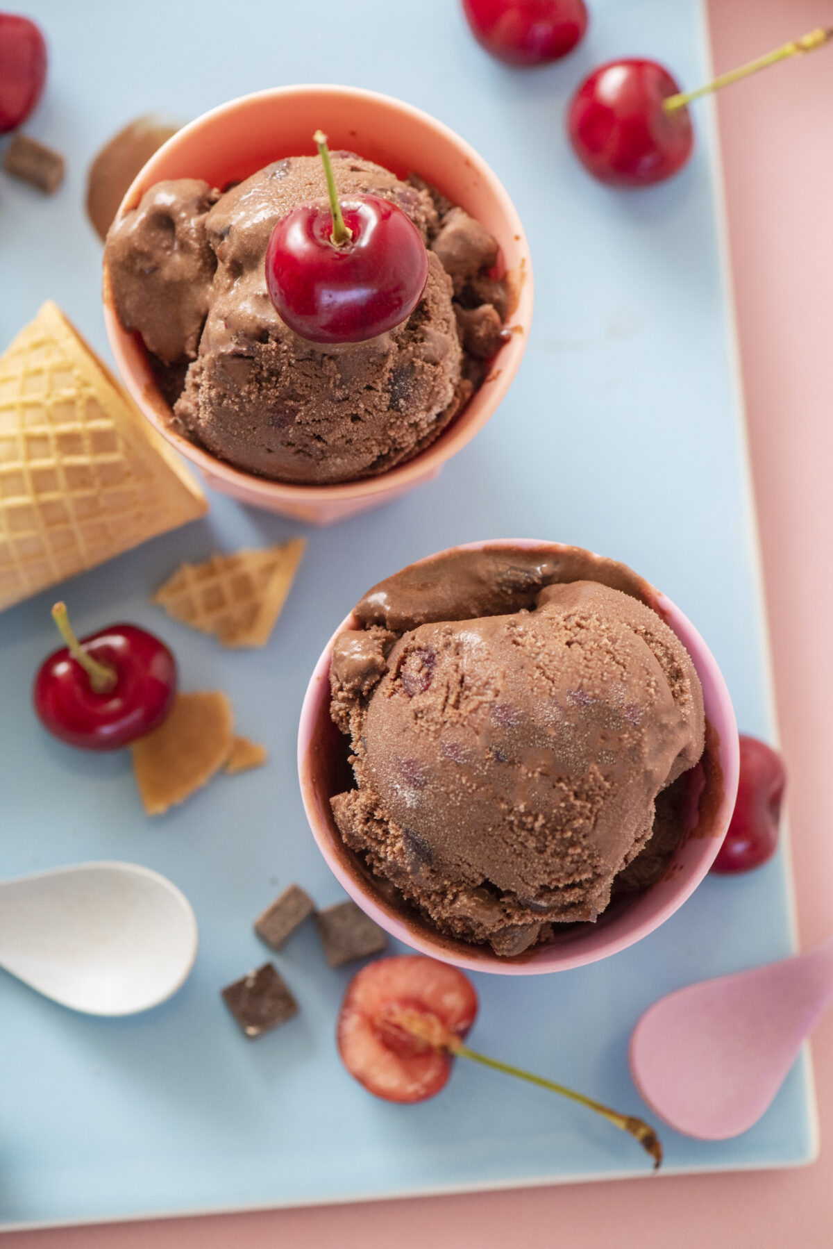 Dairy free chocolate cherry ice cream scooped into cups.