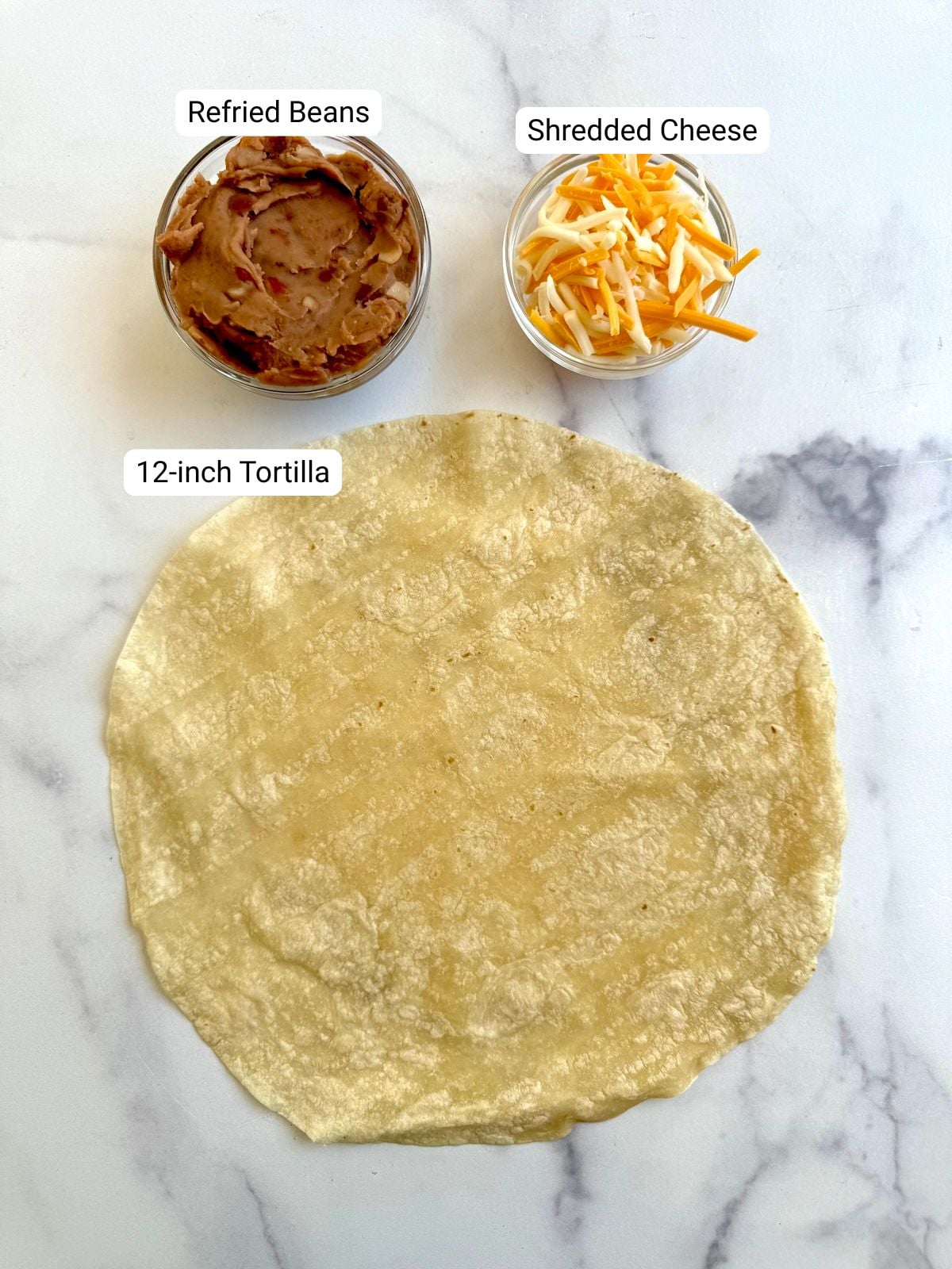 Ingredients for bean and cheese air fryer tortilla pillows.