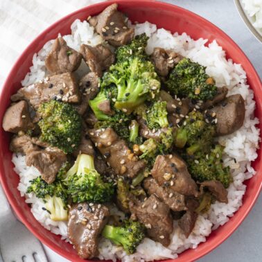Beef and broccoli served over white rice.