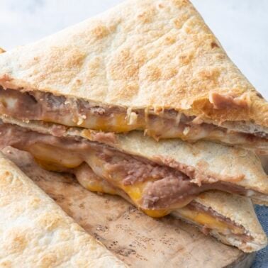 Tortilla pillows on a cutting board.