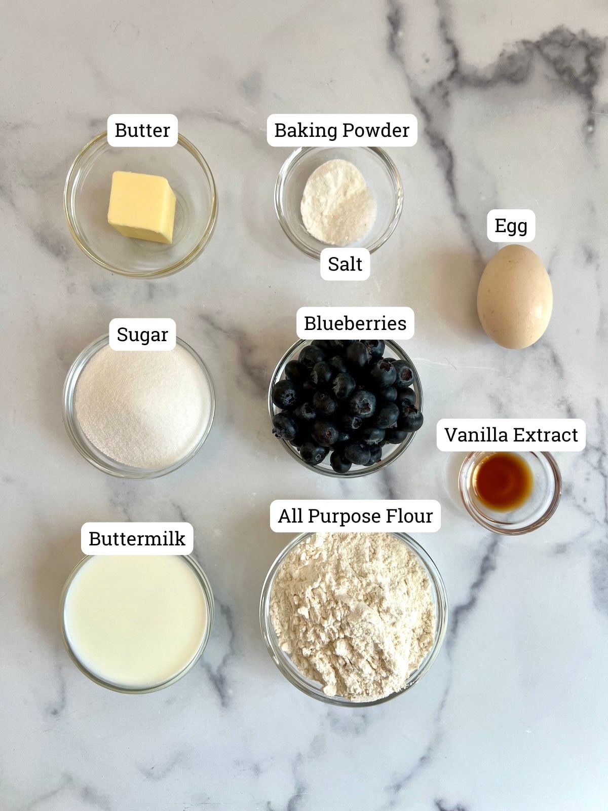 Ingredients needed to make baked blueberry donuts.