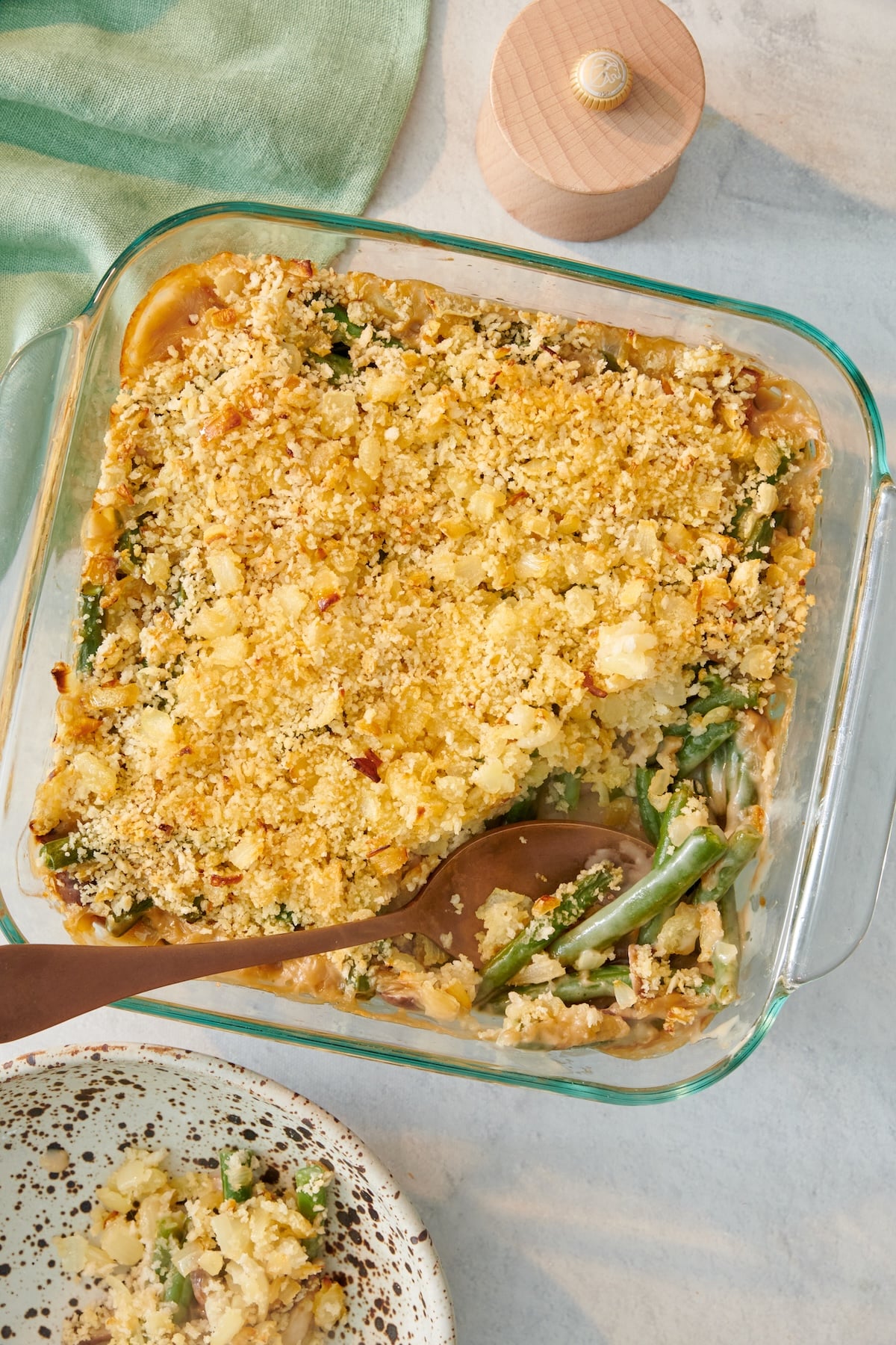 Green bean casserole in a glass baking dish.