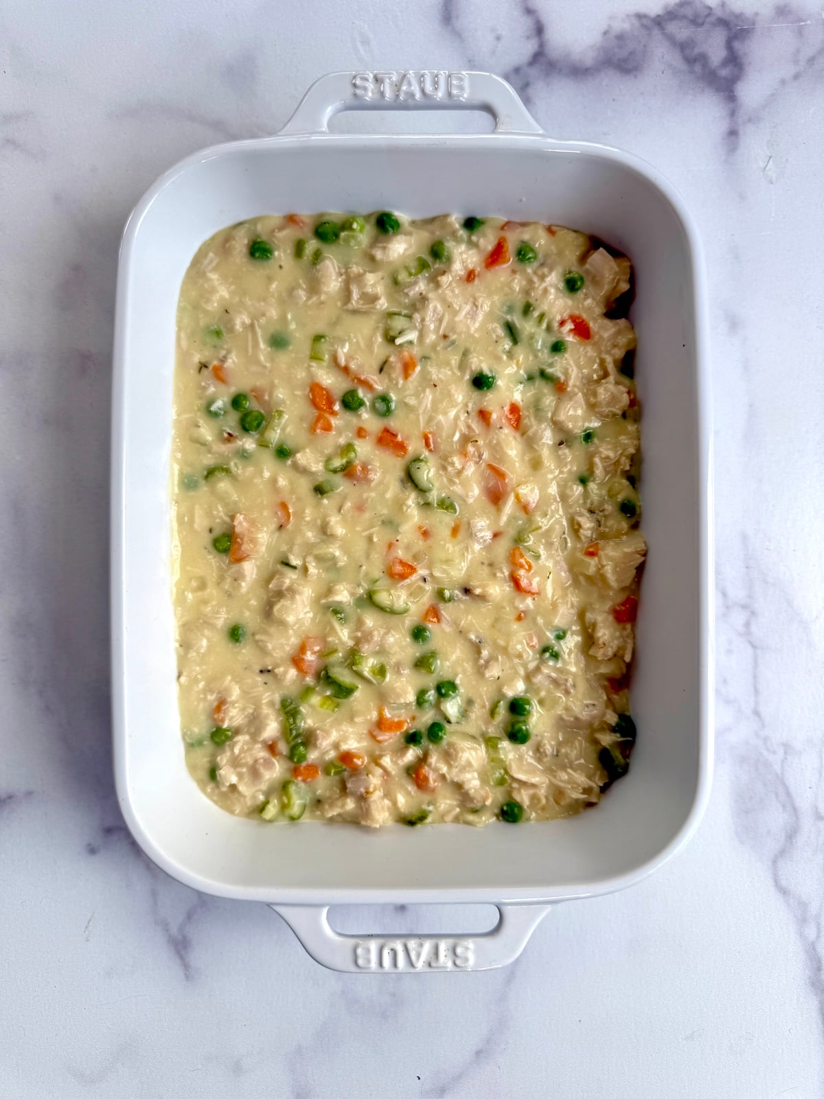 Filling for turkey shepherd's pie in a baking dish.