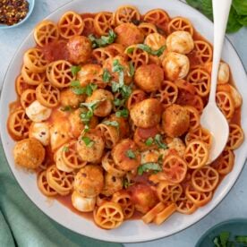 Pasta with tomato sauce and meatballs.