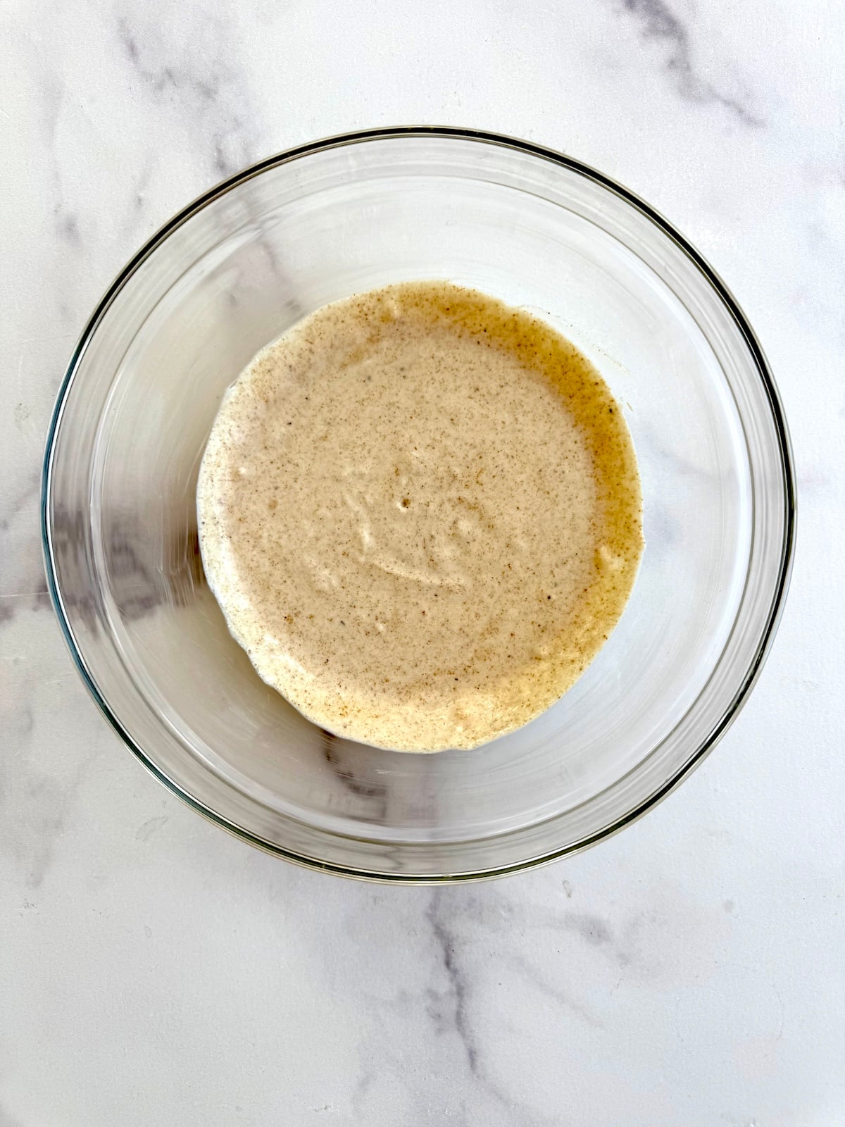 Chicken tikka marinade in a bowl.