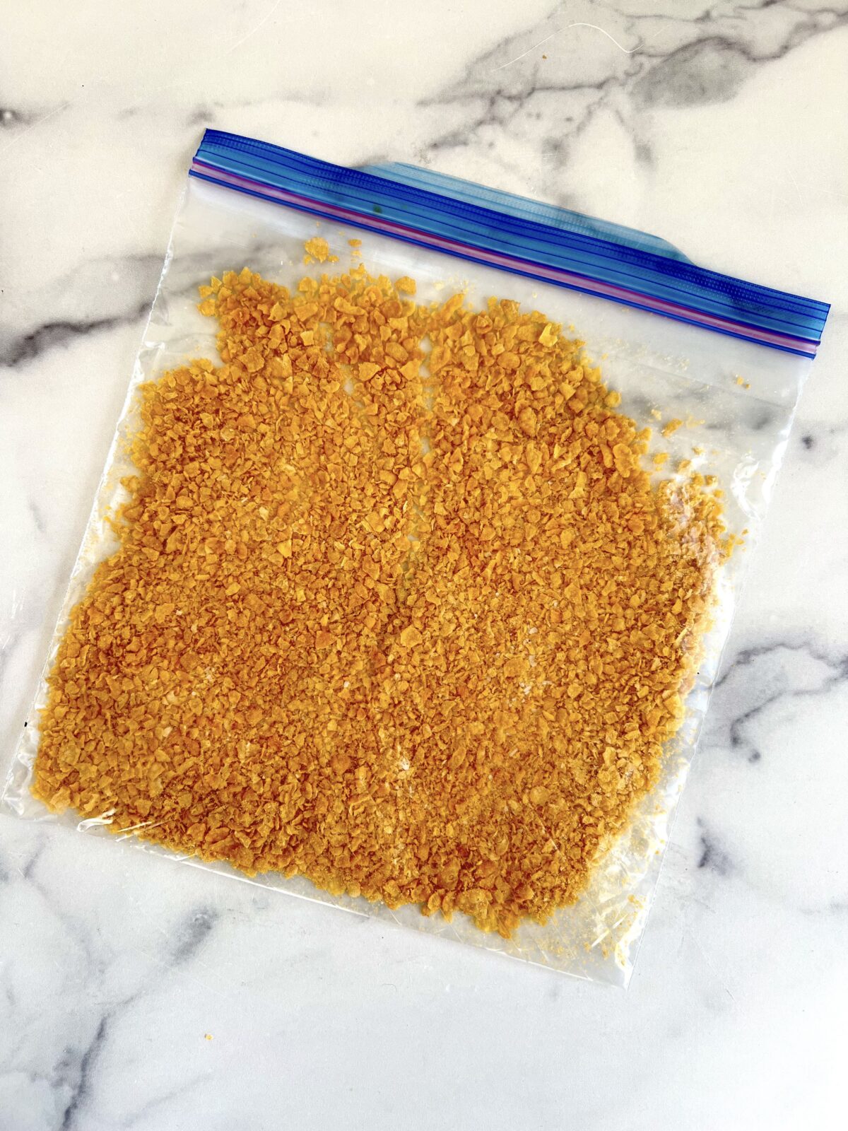 Crushed corn flakes in a plastic bag.