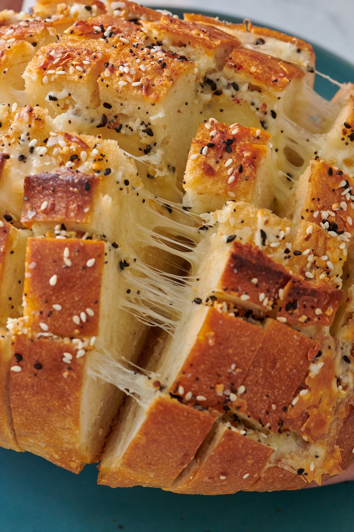Pull apart cheese bread on a plate.