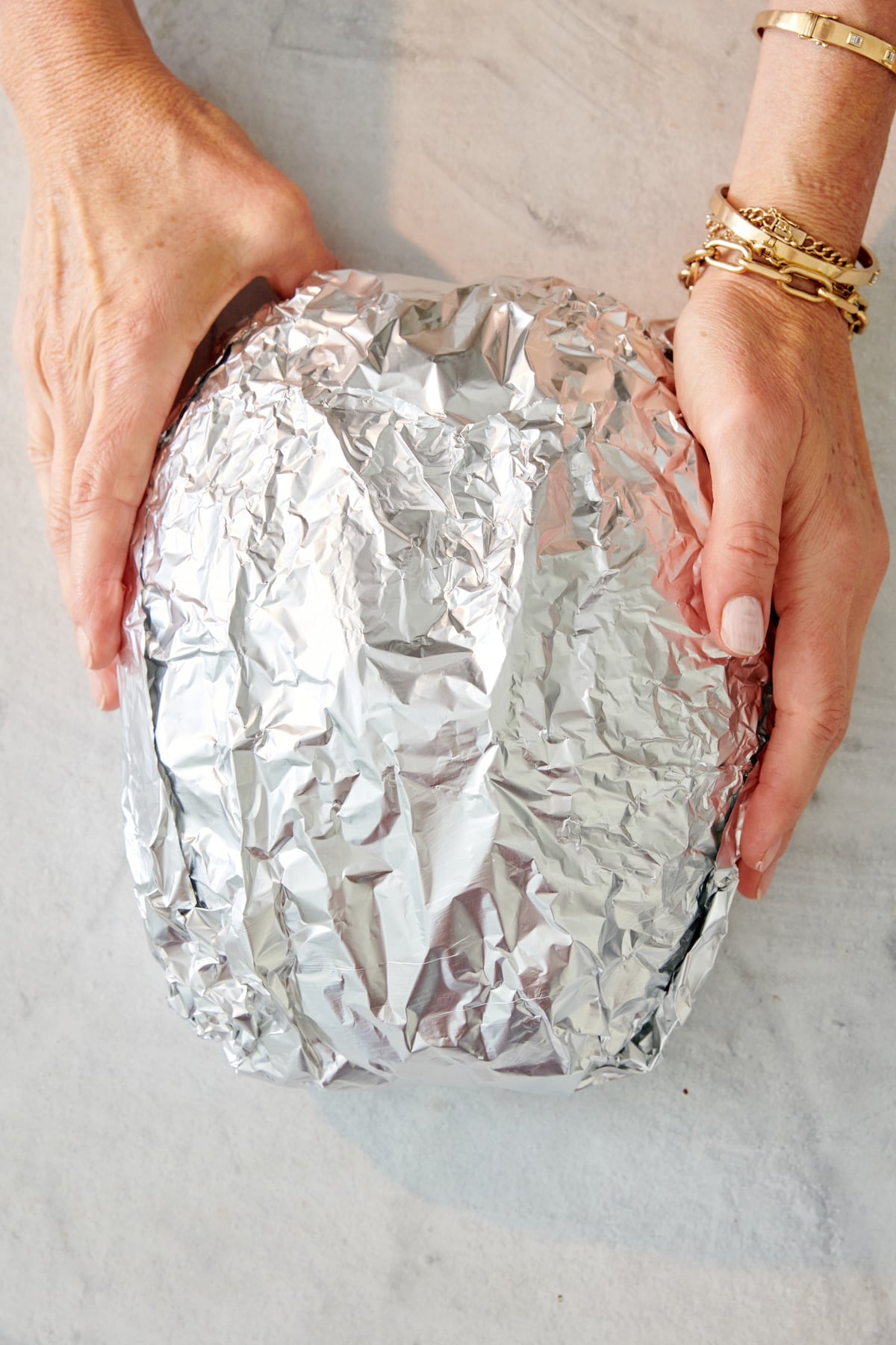 Loaf of bread wrapped in foil.