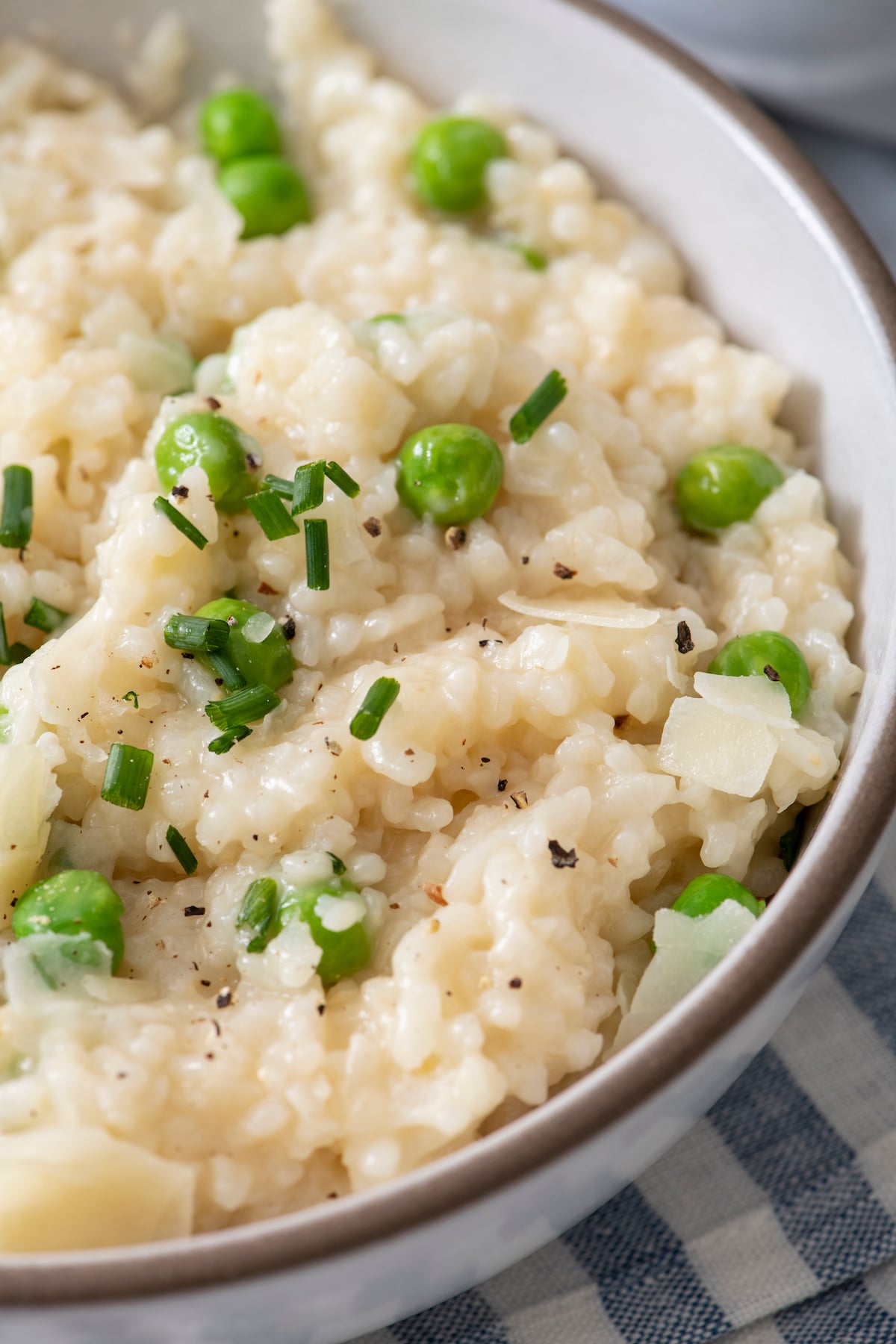close up of 15 minute spring risotto with peas and topped with chives and parmesan