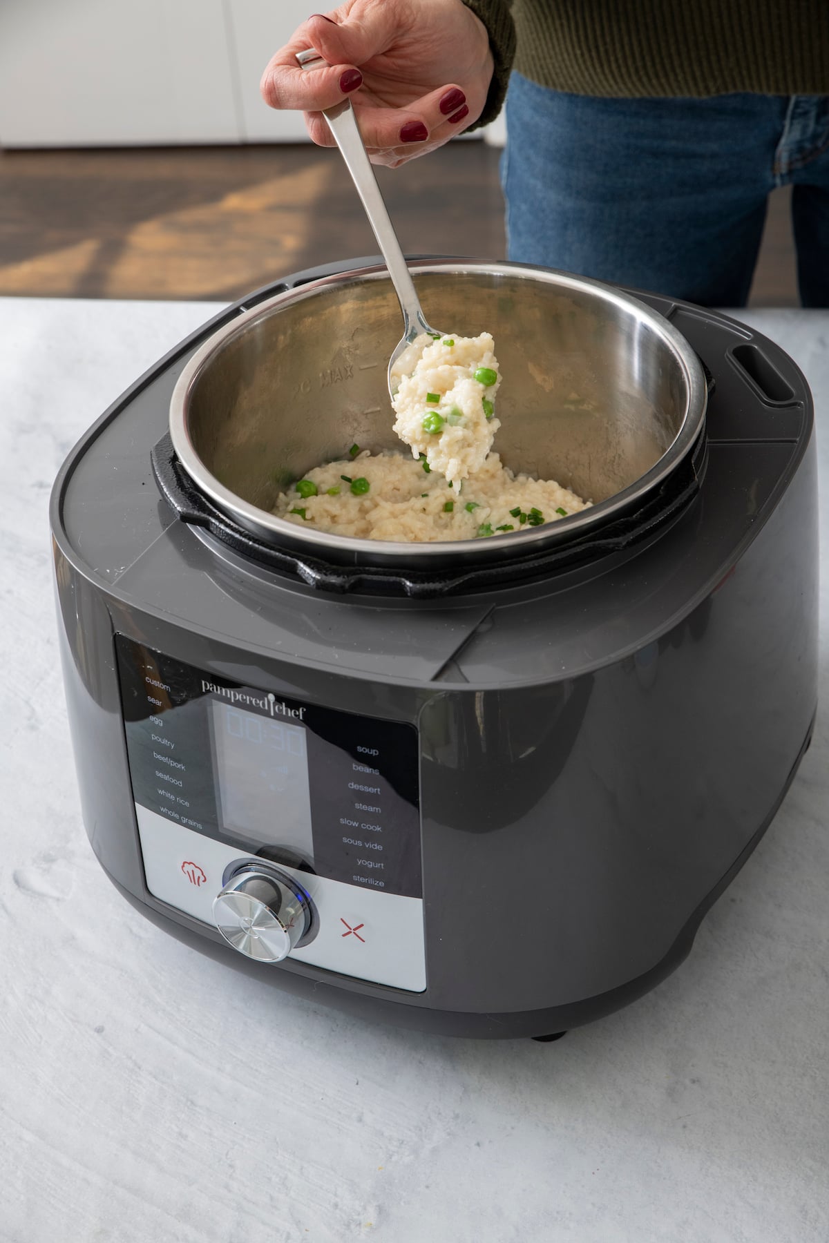 spoonful of risotto in multi cooker